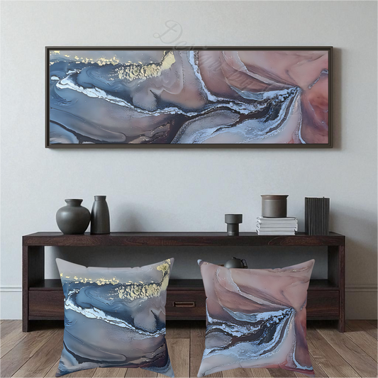 Two abstract art pillows on a wooden floor with matching wall art above a Style By Jess.