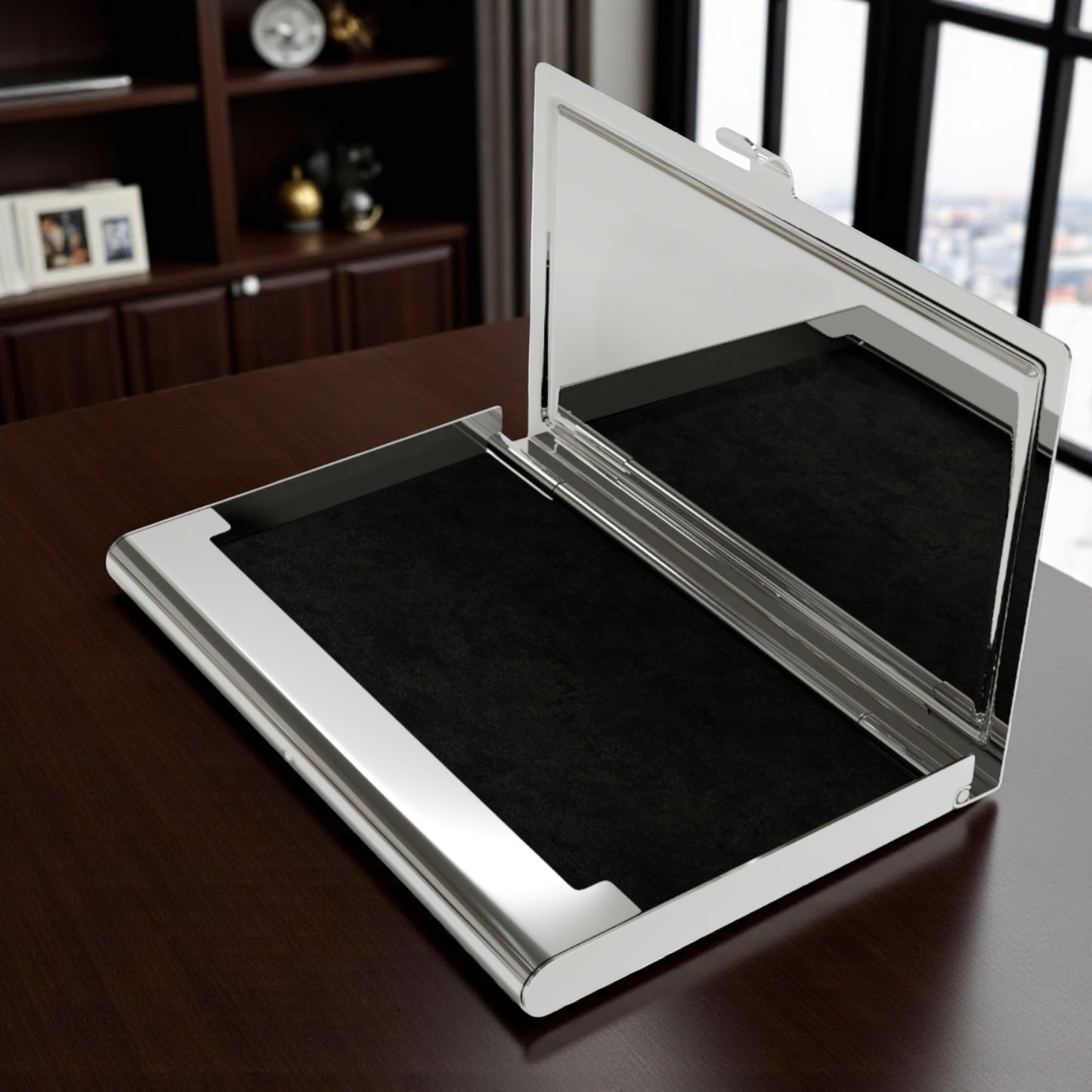 Silver rectangular business card holder featuring velvet interior with silver case