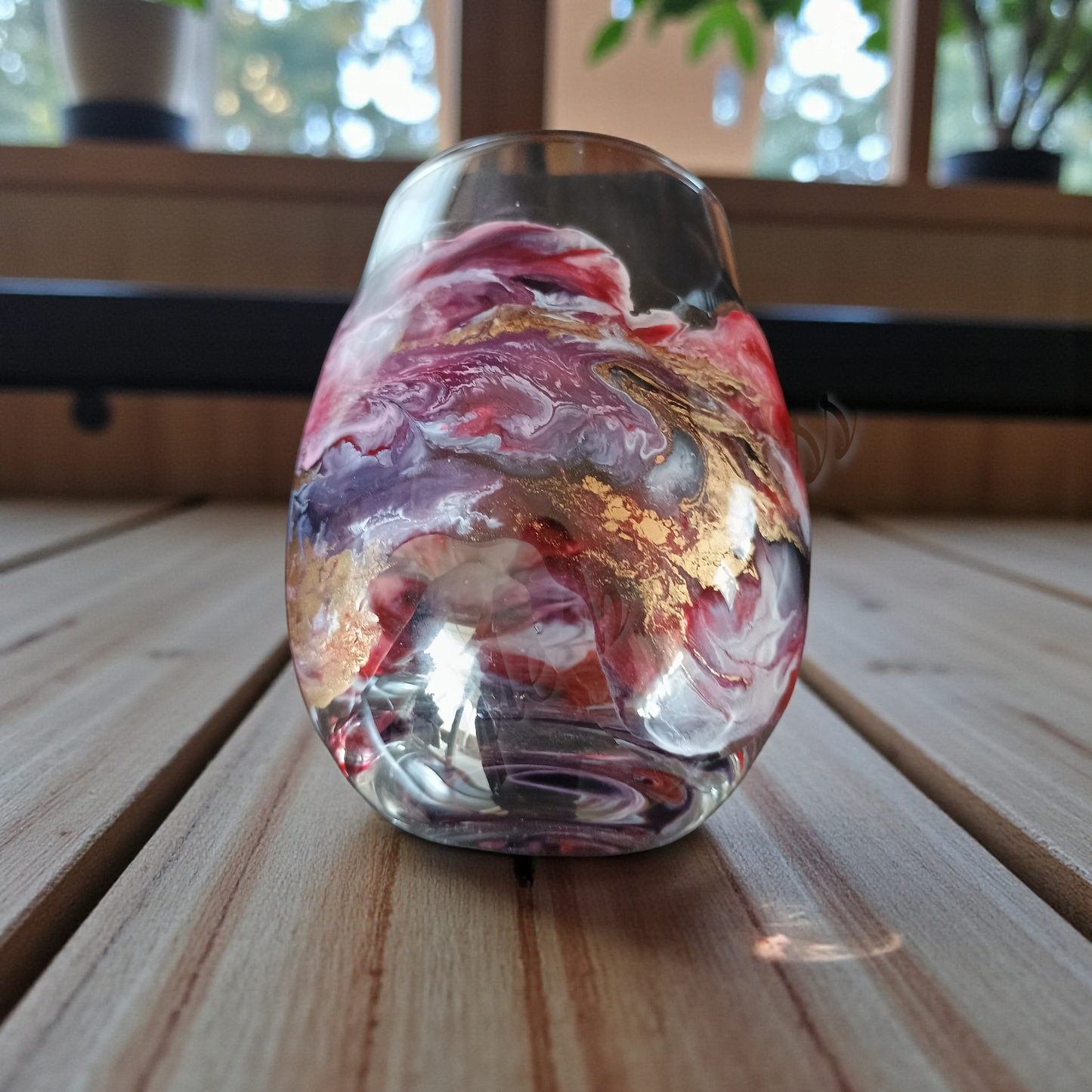One of a kind glass with marbled design on a wooden surface a Style By Jess