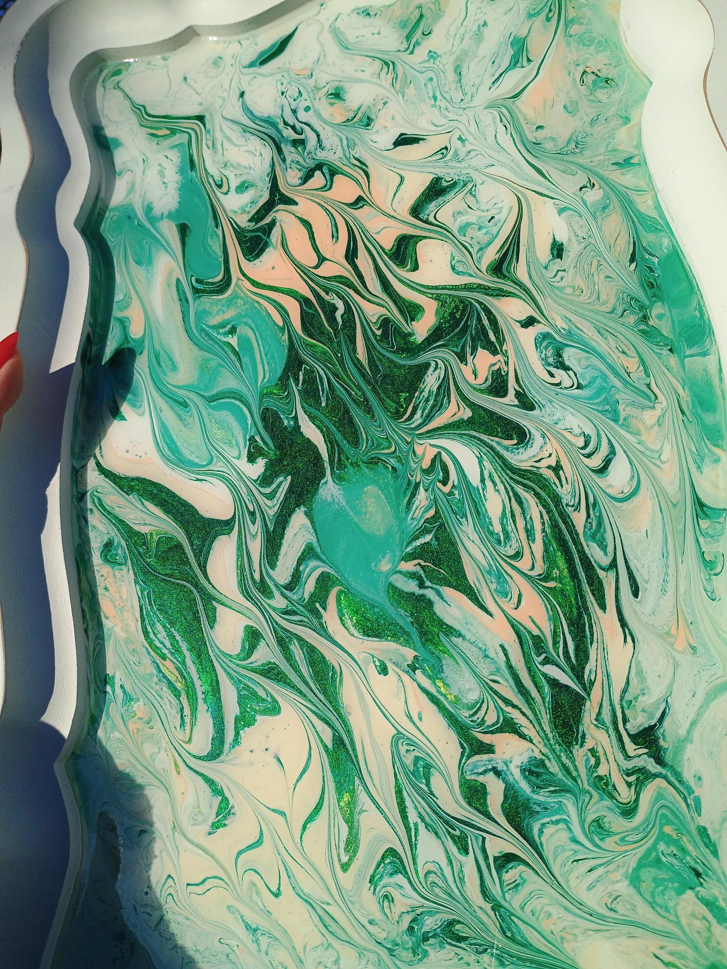 Marbled green and white design on a textured surface