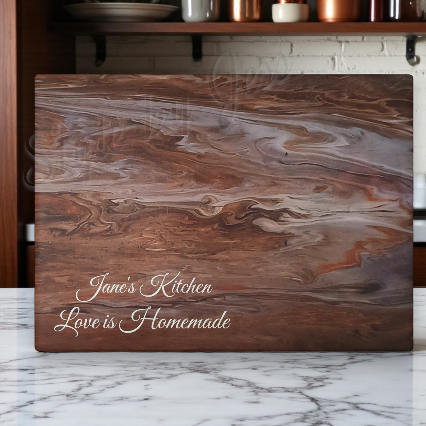 Wooden cutting board with marbled pattern and engraved text on a marble surface