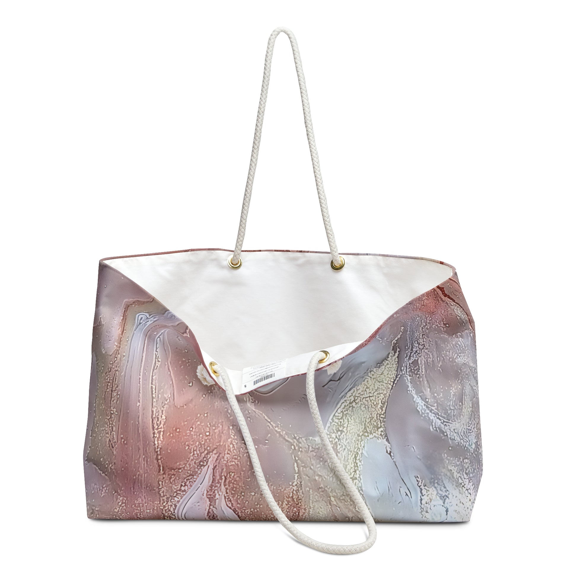 Large bag with abstract design on the exterior and the bag is open showing the white interior on a white background. Style by Jess