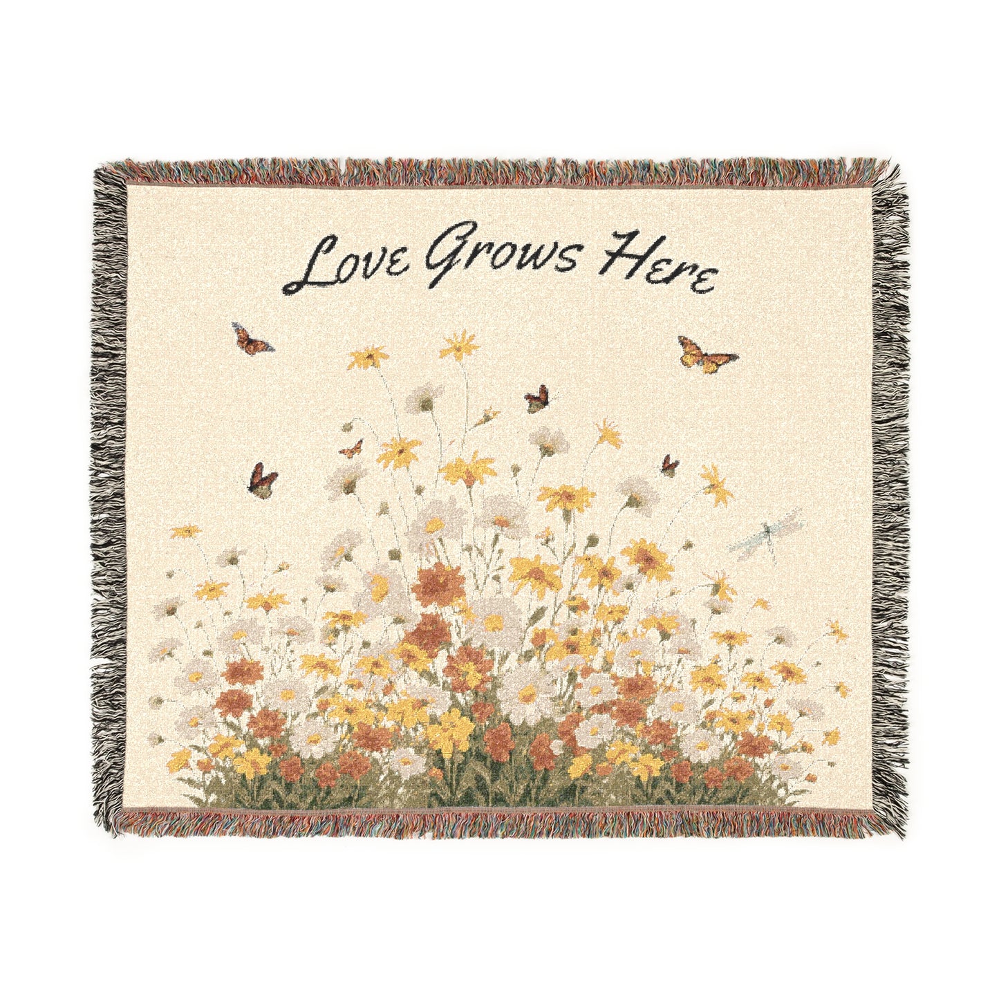 Blanket with floral design and 'Love Grows Here' text on a white background