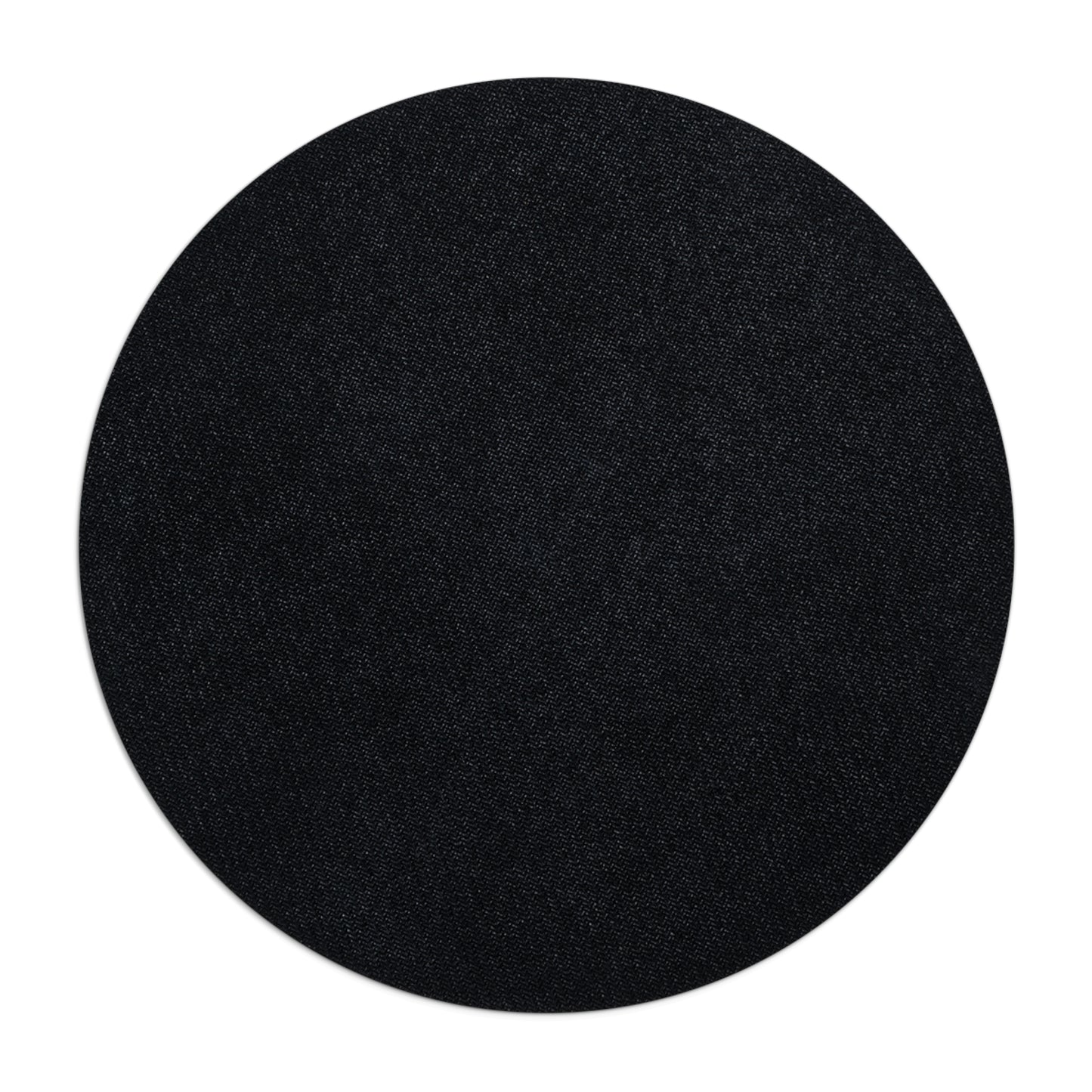 Black circular mouse pad image of the back non slip surface on a white background