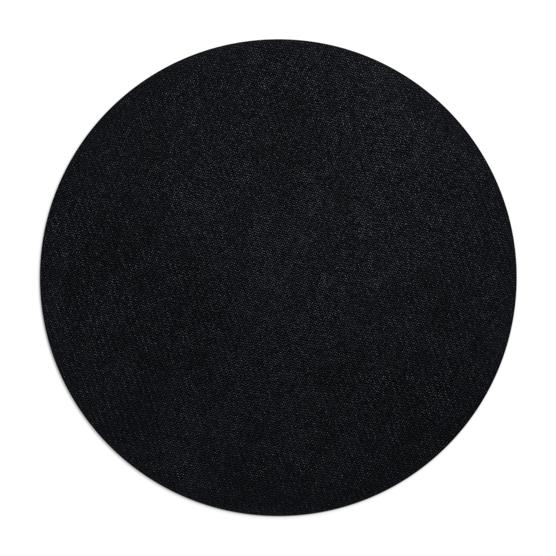 Black circular mouse pad image of the back non slip surface on a white background