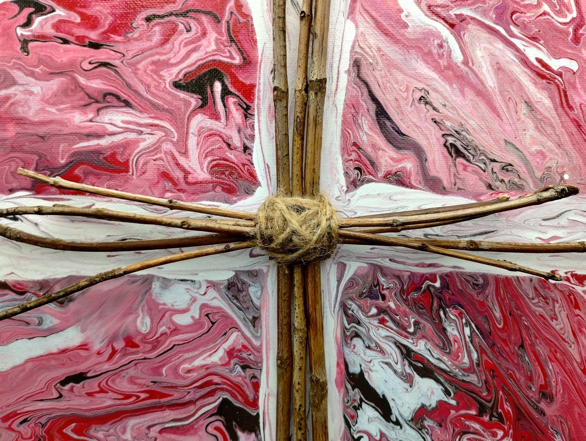 Decorative cross with pink and white marbled background