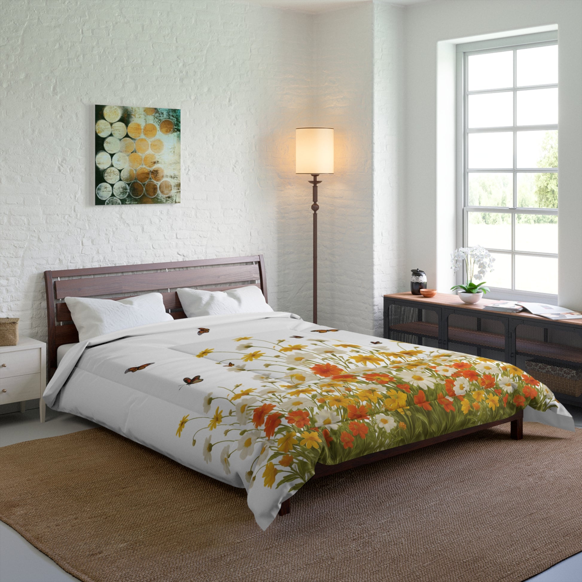 Bedroom with floral comforter, lamp, and artwork on a white brick wall.