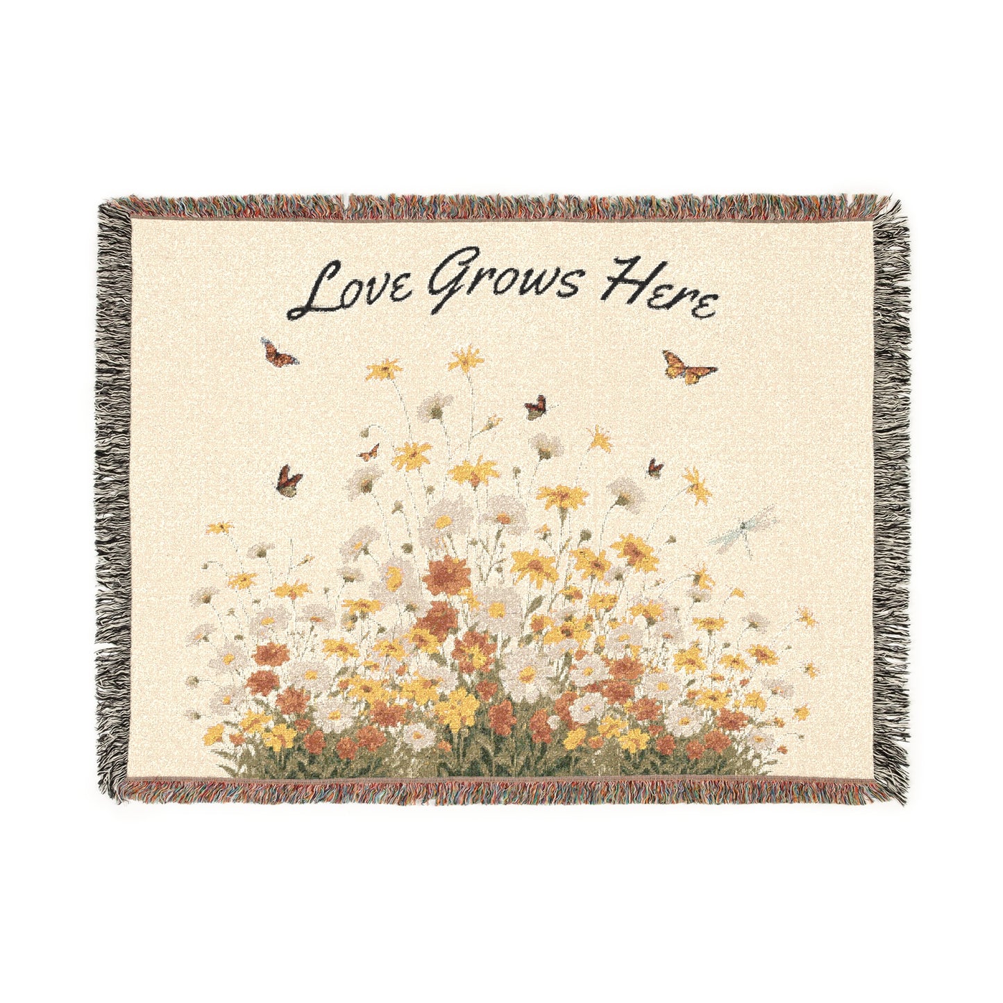 Woven blanket with floral design and 'Love Grows Here' text on a white background