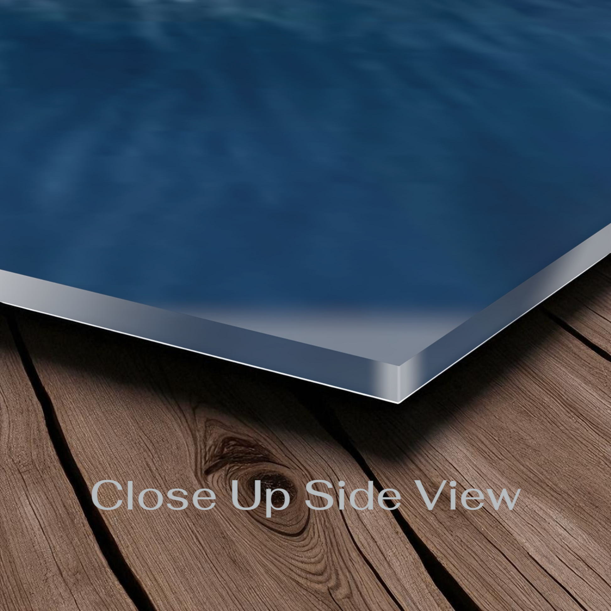Close-up side view of a blue pool cover on wooden deck