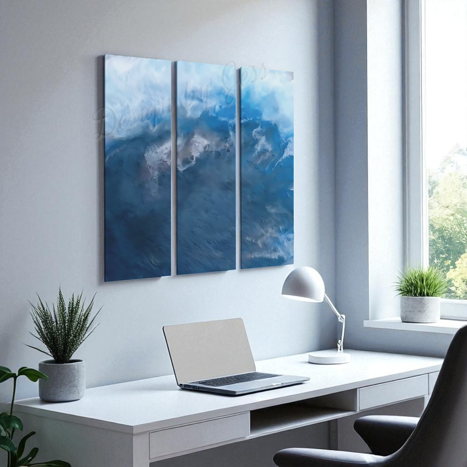 Modern office space with a desk, laptop, lamp, and wall art.