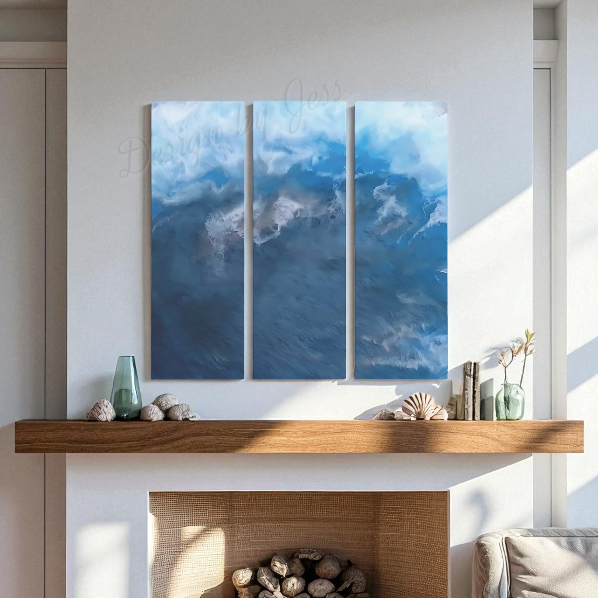 Three abstract blue artworks above a fireplace with decorative items.