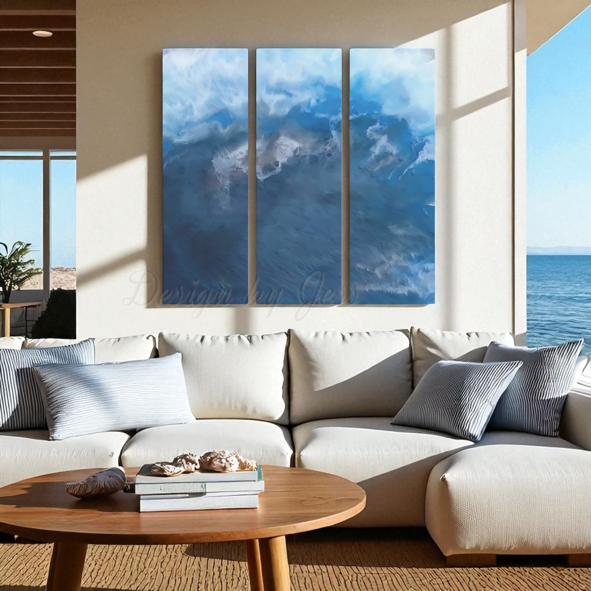 Modern living room with a large sectional sofa, coffee table, and wall art depicting a coastal scene.