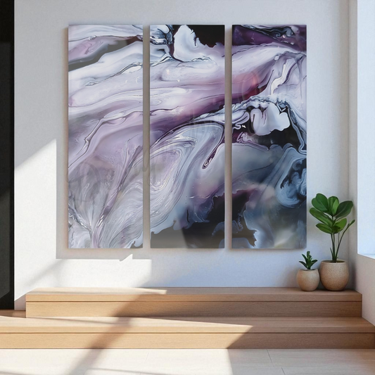 Triptych abstract painting on a wall with a wooden shelf and plants below.