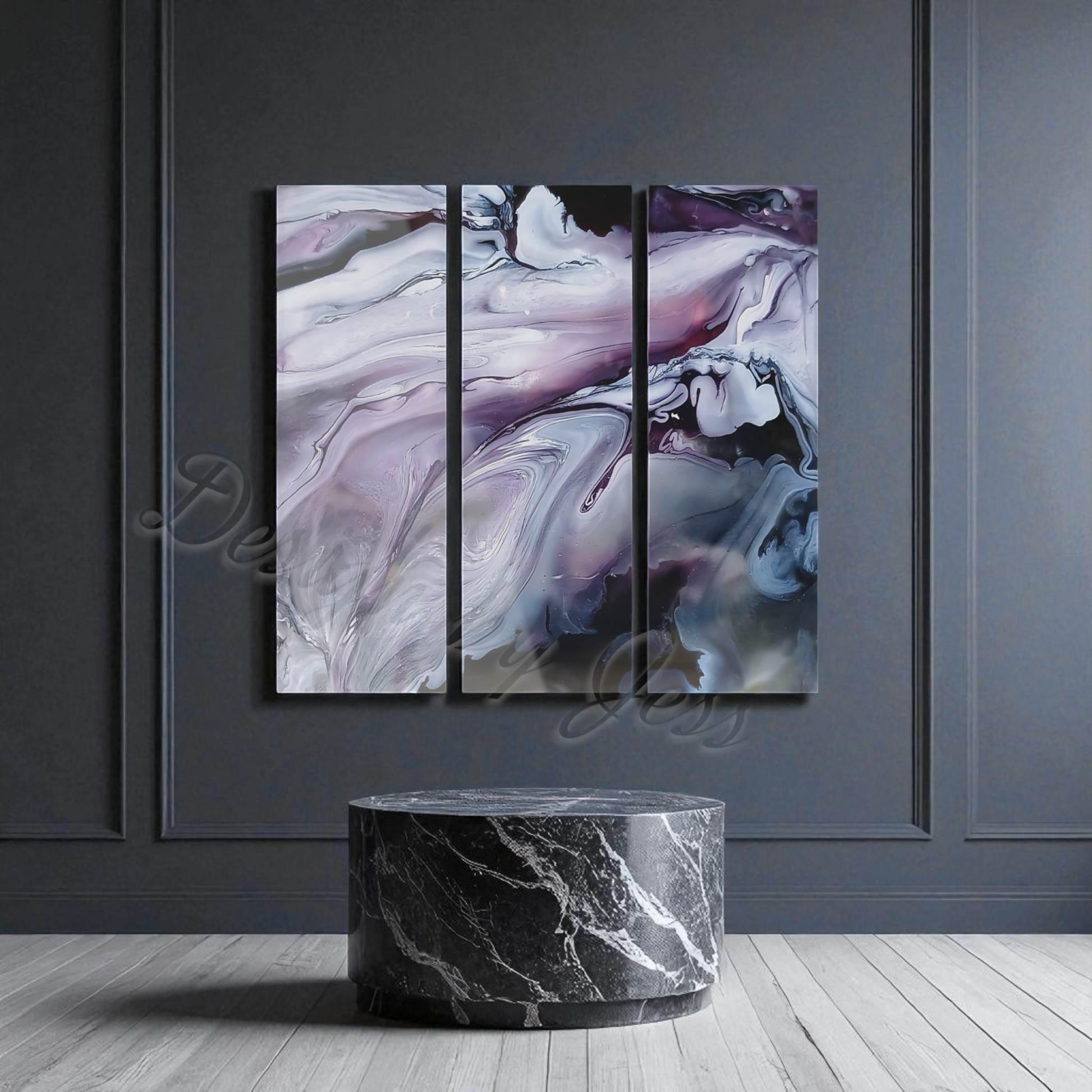 Abstract art triptych on a gray wall with a marble table below