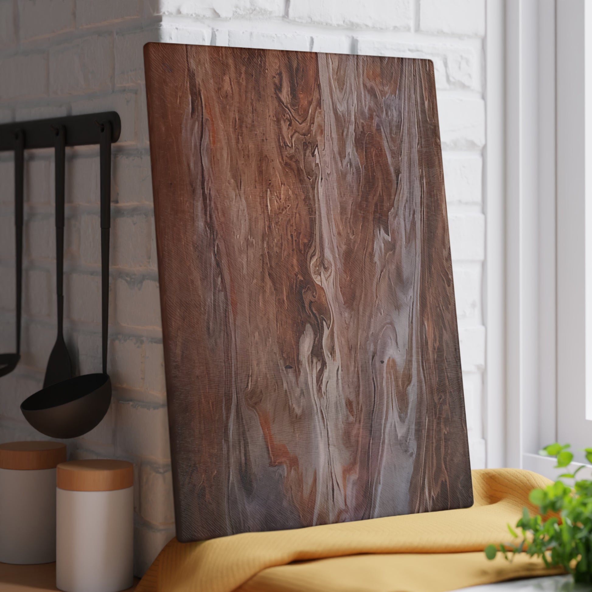 Glass cutting board with a marbled pattern in a kitchen setting
