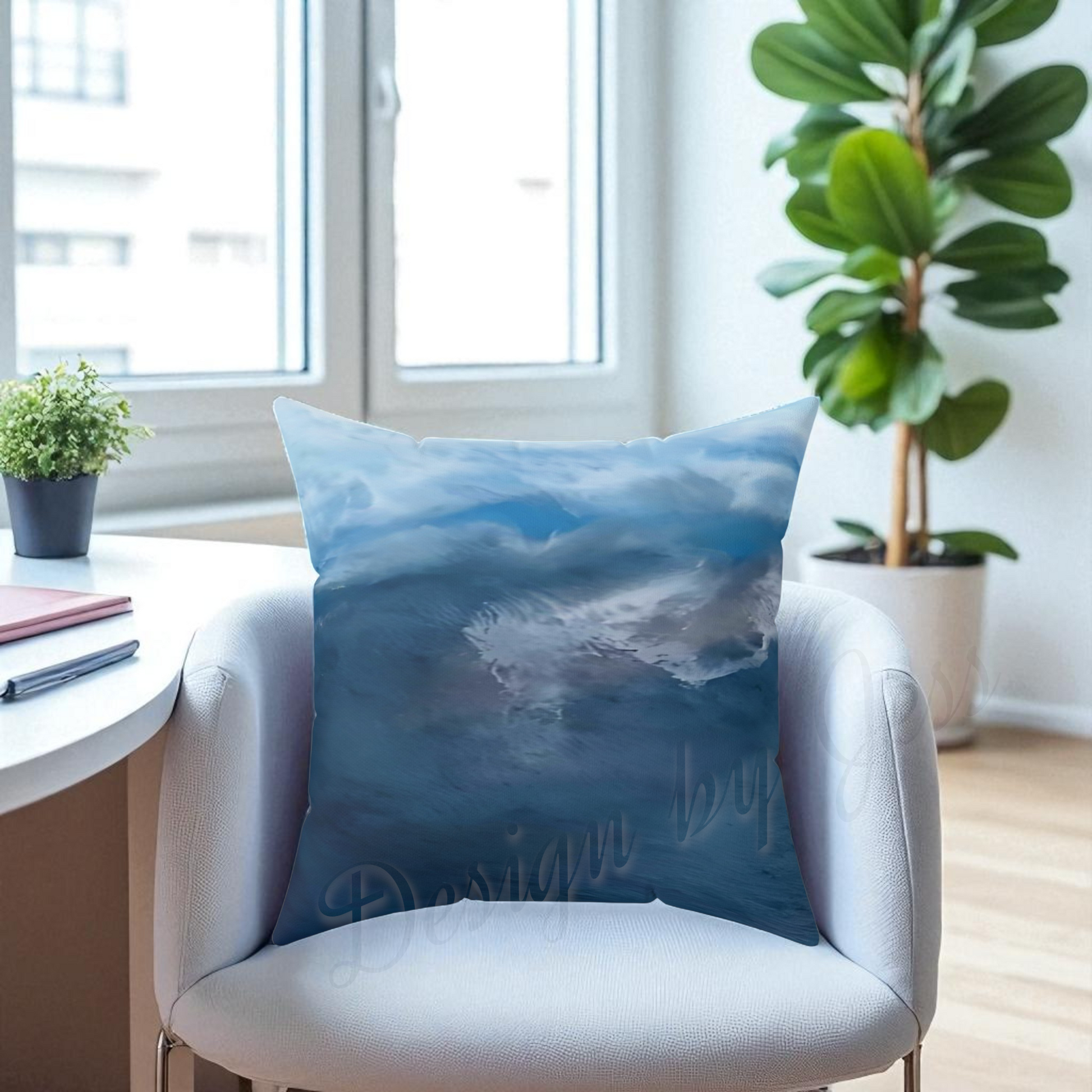 Decorative pillow with a blue ocean design on a chair in a room with plants and a window.