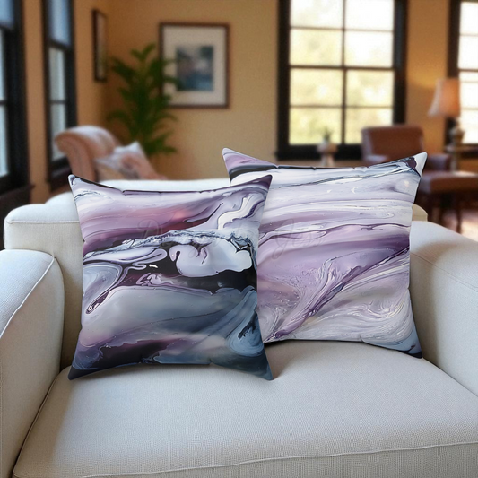 Marble-patterned pillows on a beige sofa in a living room setting.