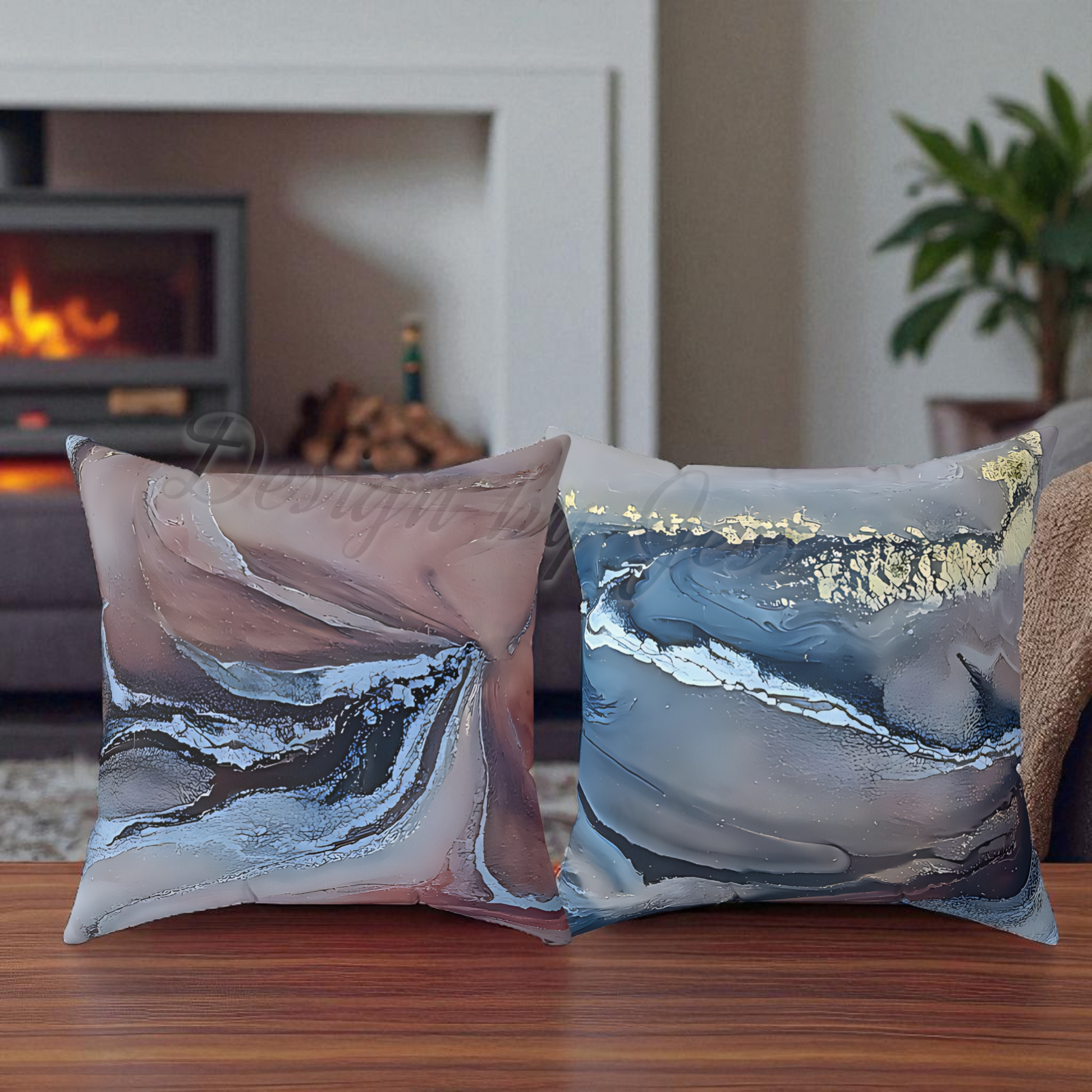 Two decorative pillows with abstract designs on a wooden surface in a cozy living room setting.