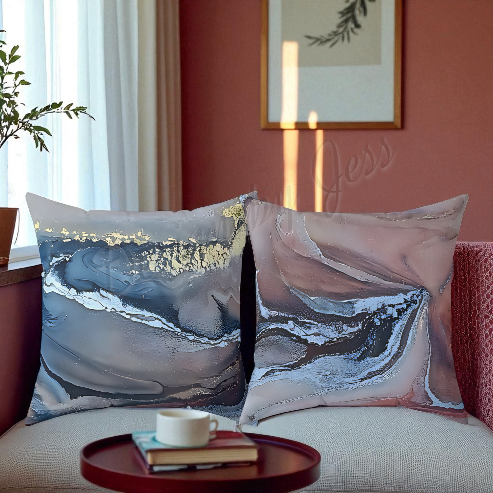 Two decorative pillows with abstract designs on a couch in a living room.