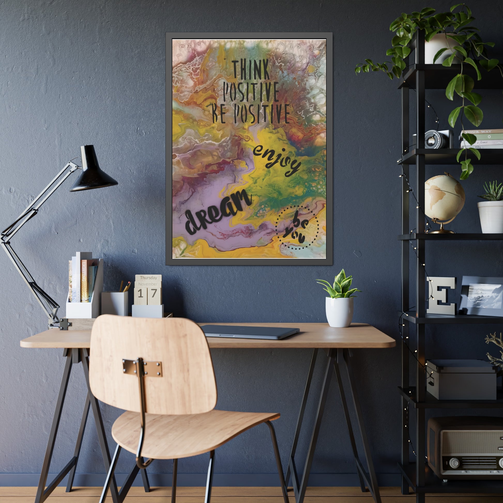 Colorful motivational poster on a wall above a desk with a lamp and chair.