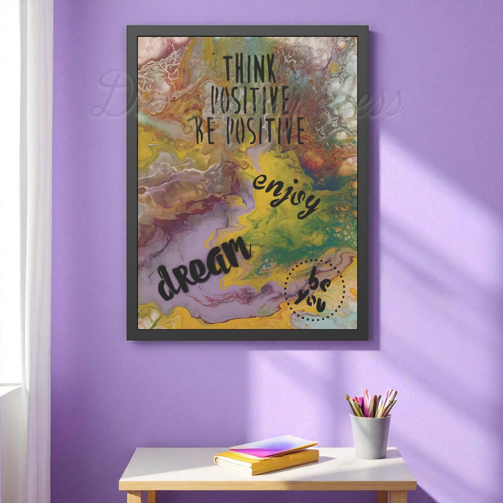 Framed motivational poster with colorful abstract design and text on a purple wall.