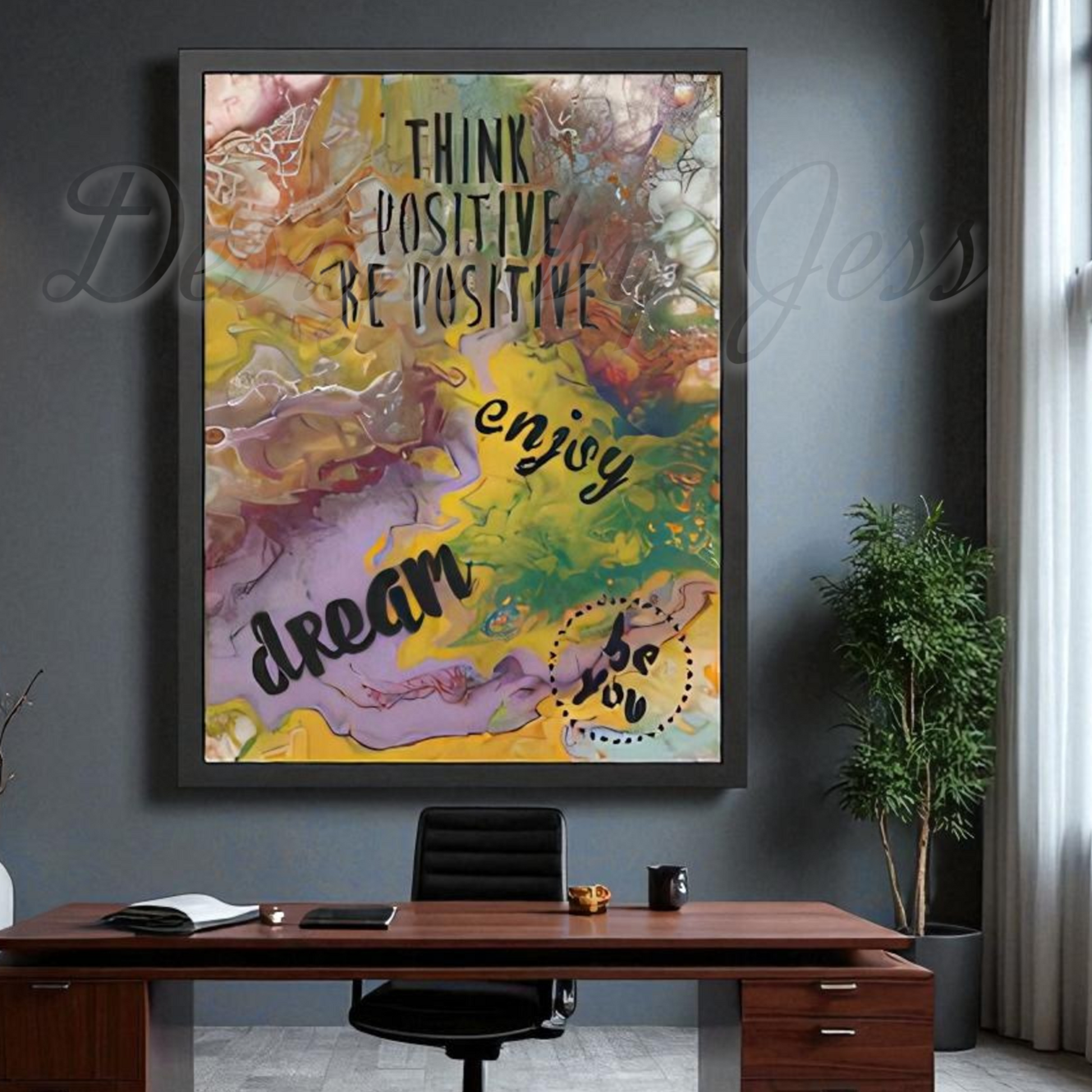 Colorful abstract wall art with motivational text in a home office setting.