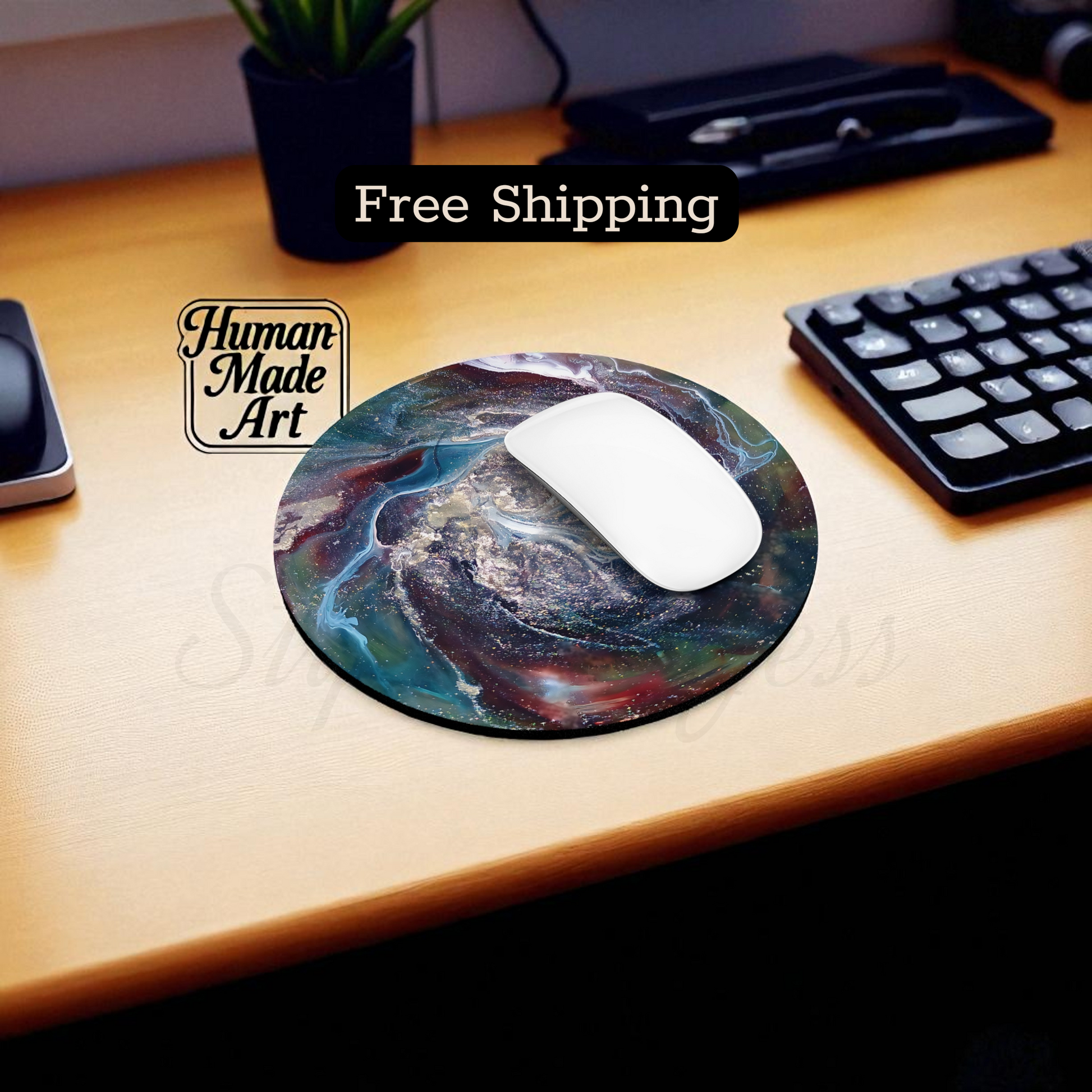 Mouse pad with artistic design on a desk with keyboard and mouse, featuring 'Human Made Art' brand.