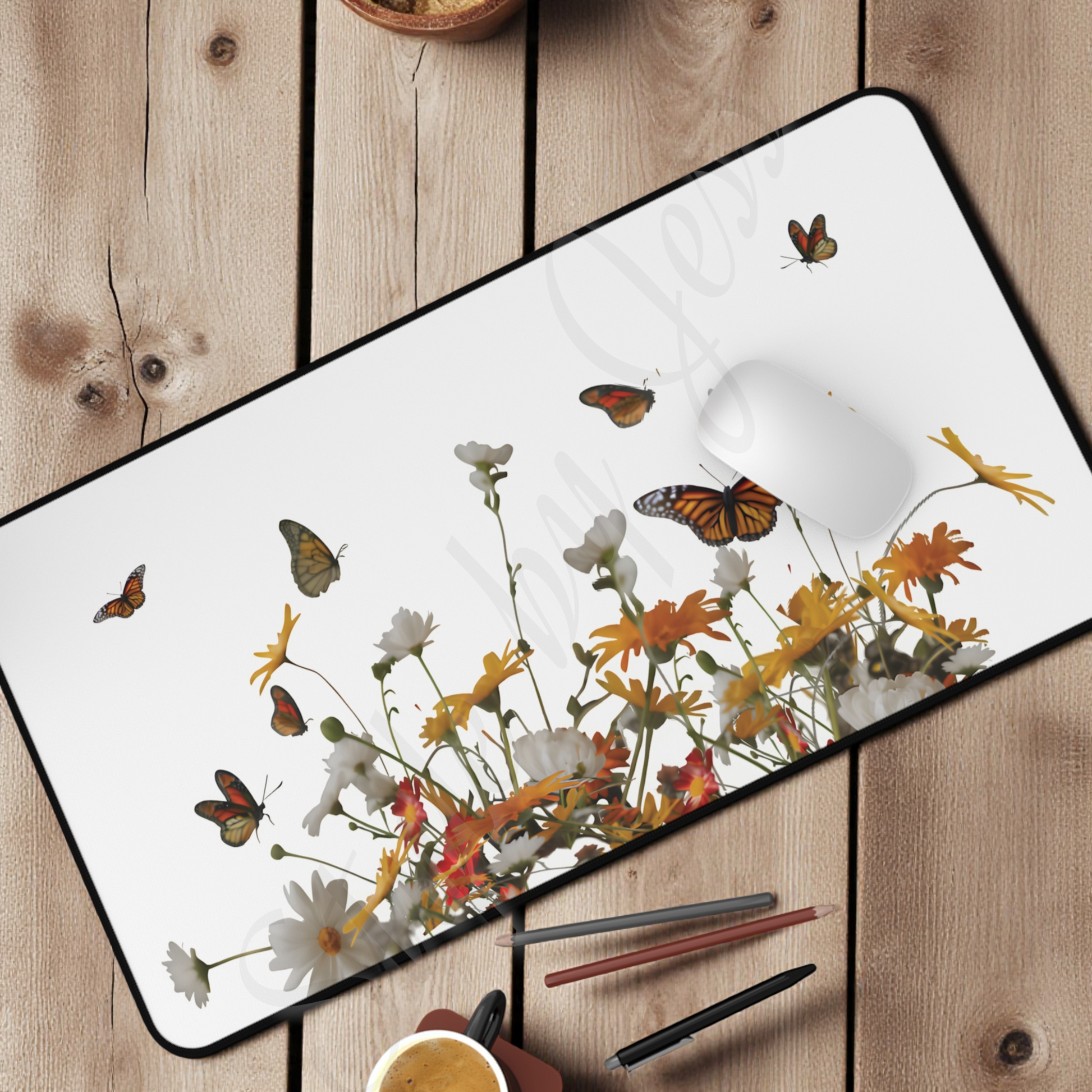 Desk mat with butterfly and floral design on a wooden surface