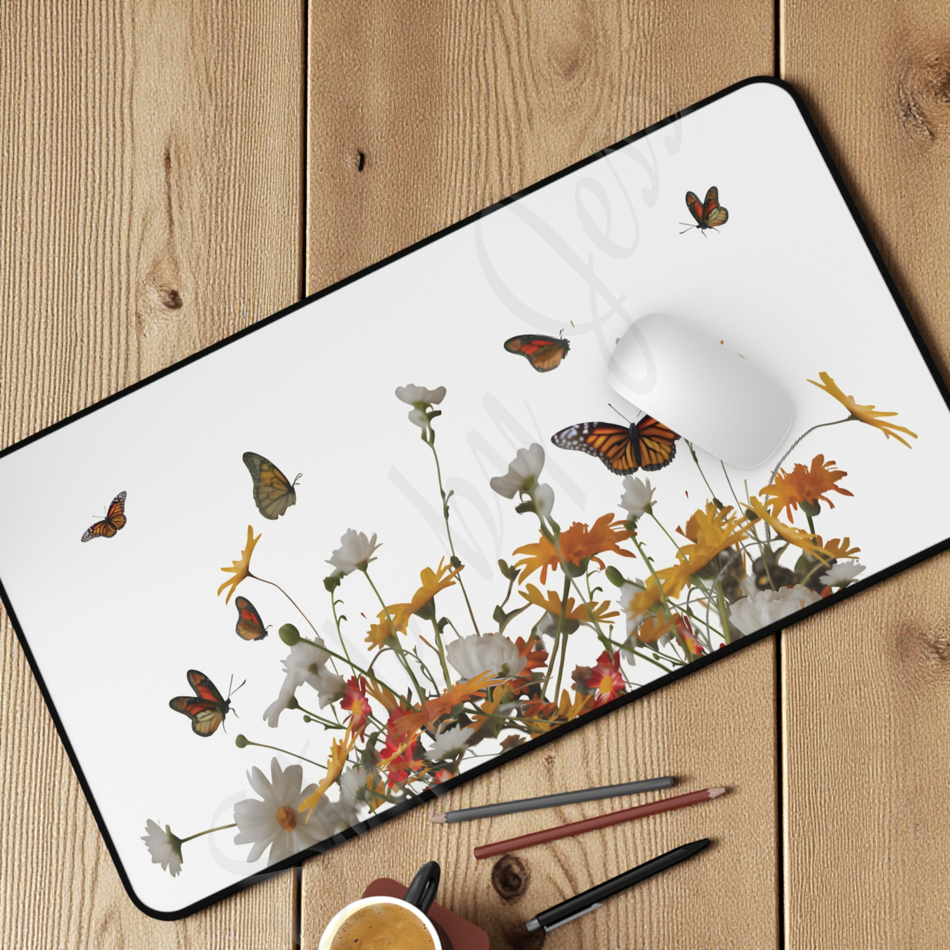 Oversized desk mouse pad for the office with a butterfly and floral design on a wooden surface
