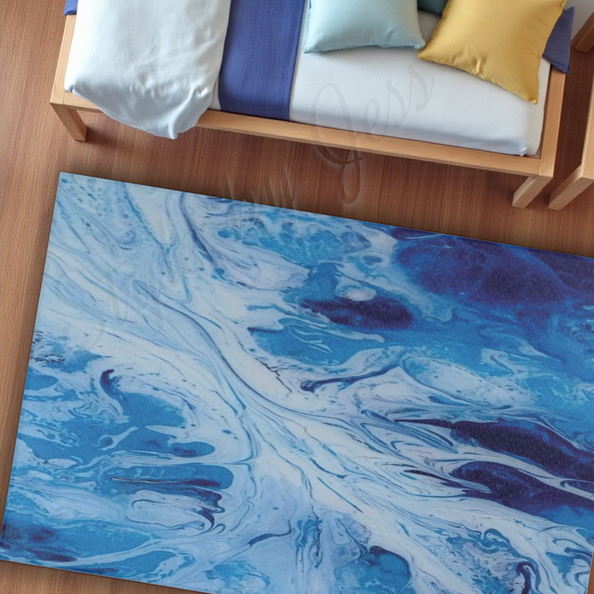 Blue and white marbled rug on a wooden floor with a bed in the background.
