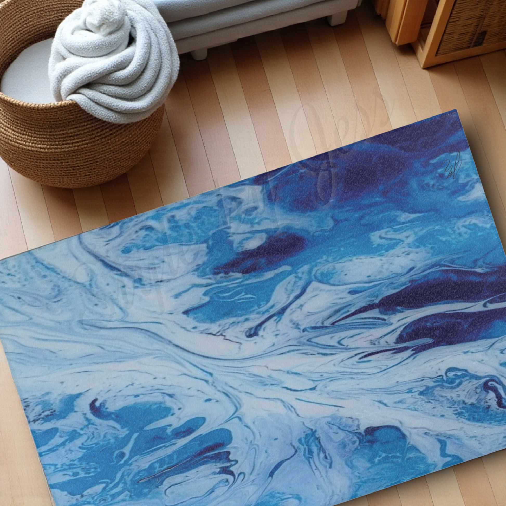 Blue marbled area rug on a wooden floor with a basket of towels in the background.