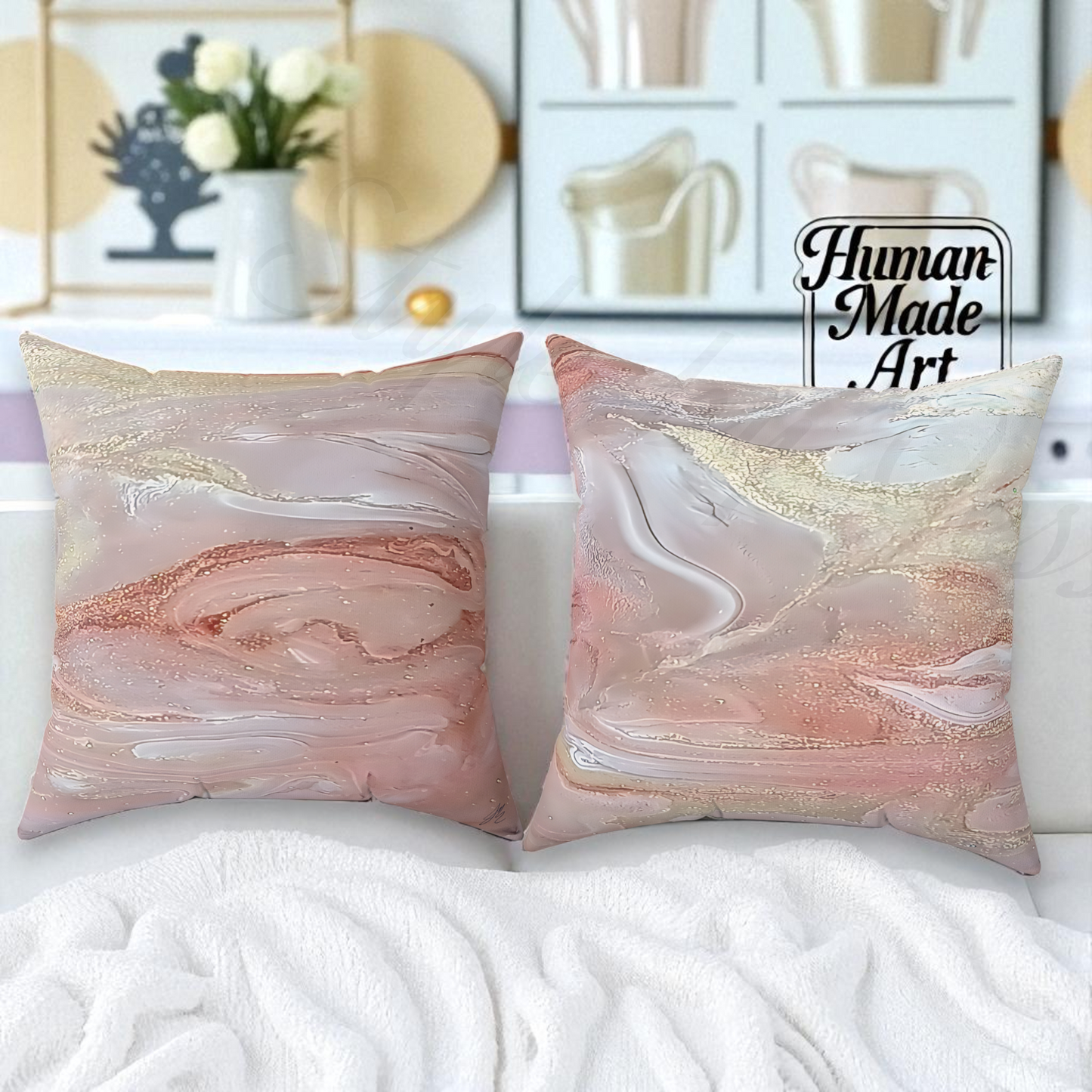 Two marbled patterned pillows on a white surface with 'Human Made Art' branding.
