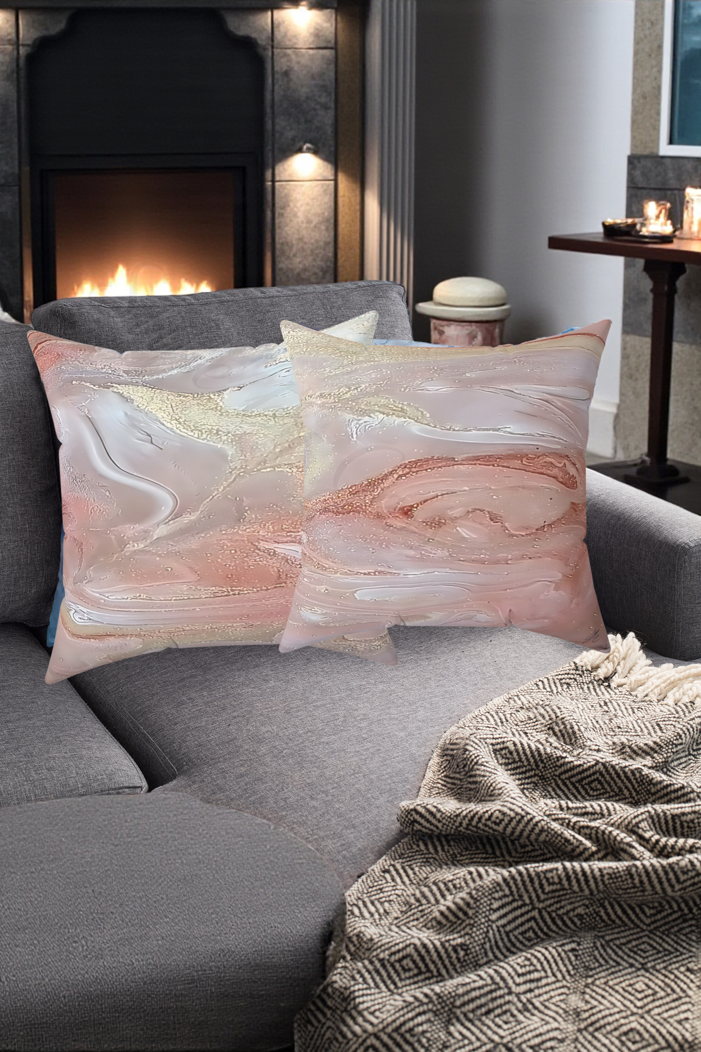 Marble-patterned cushions on a gray sofa with a fireplace in the background