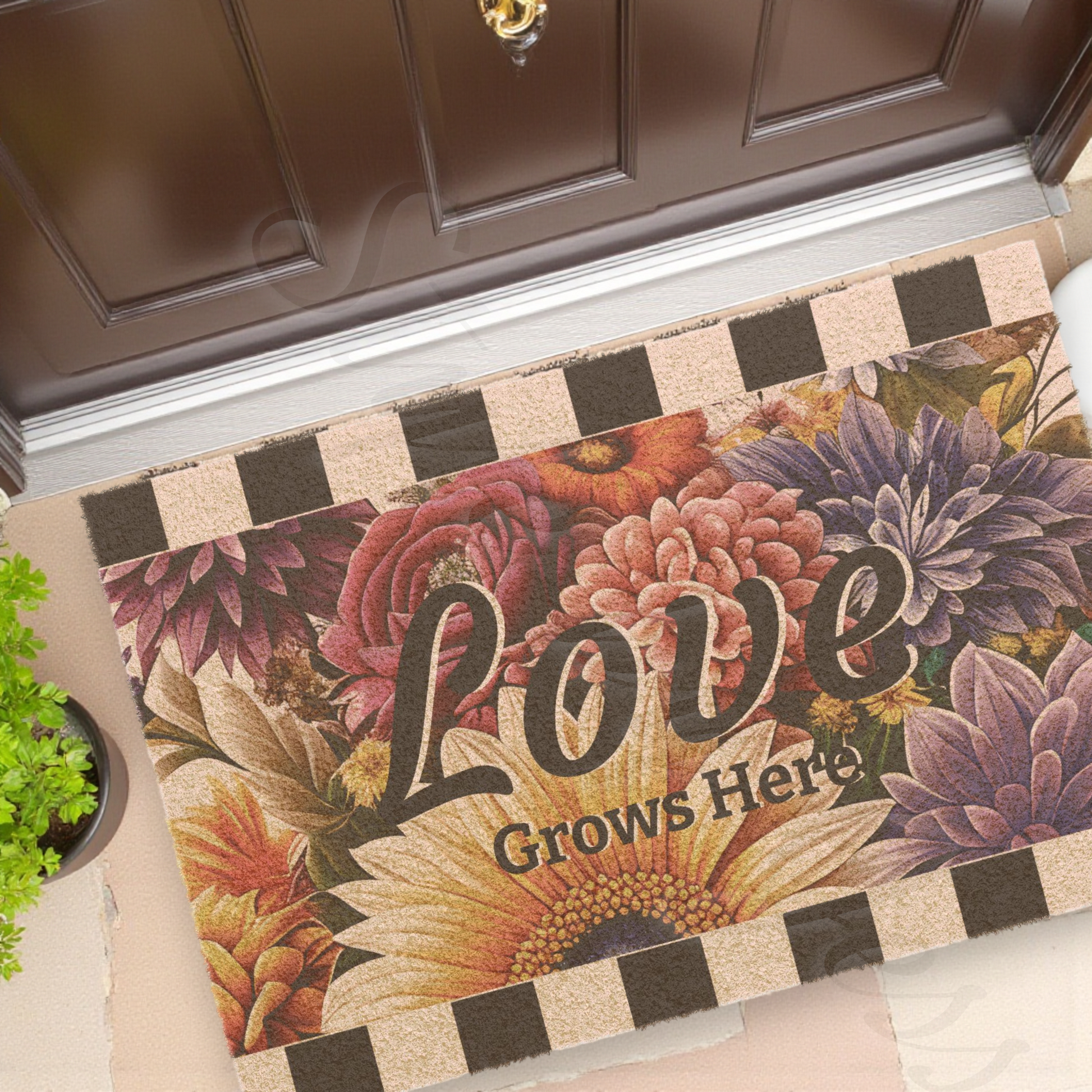 Decorative doormat with floral design and 'Love Grows Here' text at the entry doorway of a home a Style by Jess at Gotta Have It Design.