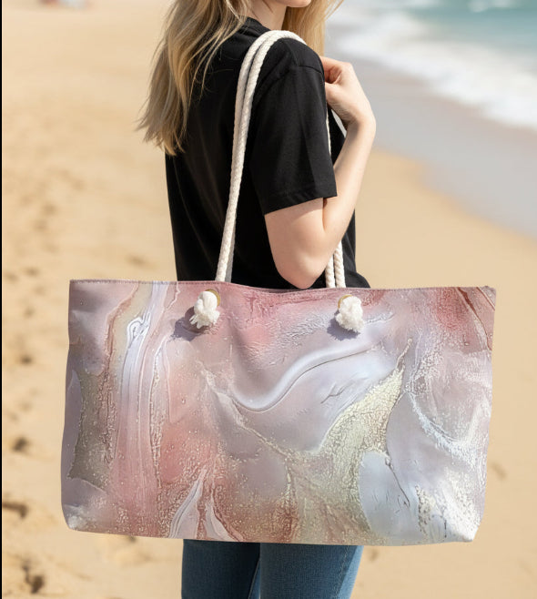 Woman holding a large beach bag with a white, gold and pink abstract marble type design a print of an original handmade art by Jess with Style By Jess
