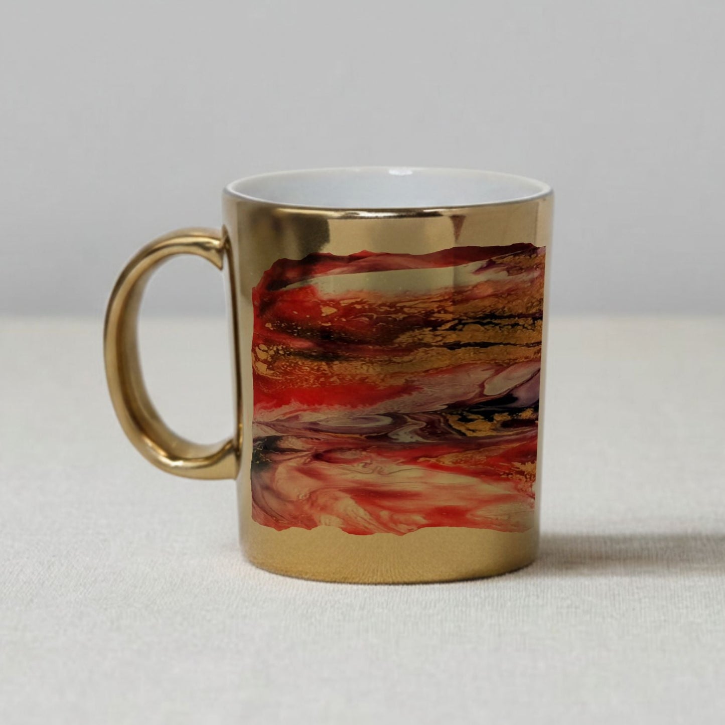 Mug with gold handle and marbled design on a ceramic mug featuring a print of an original abstract art piece a Style by Jess at Gotta Have It Design.