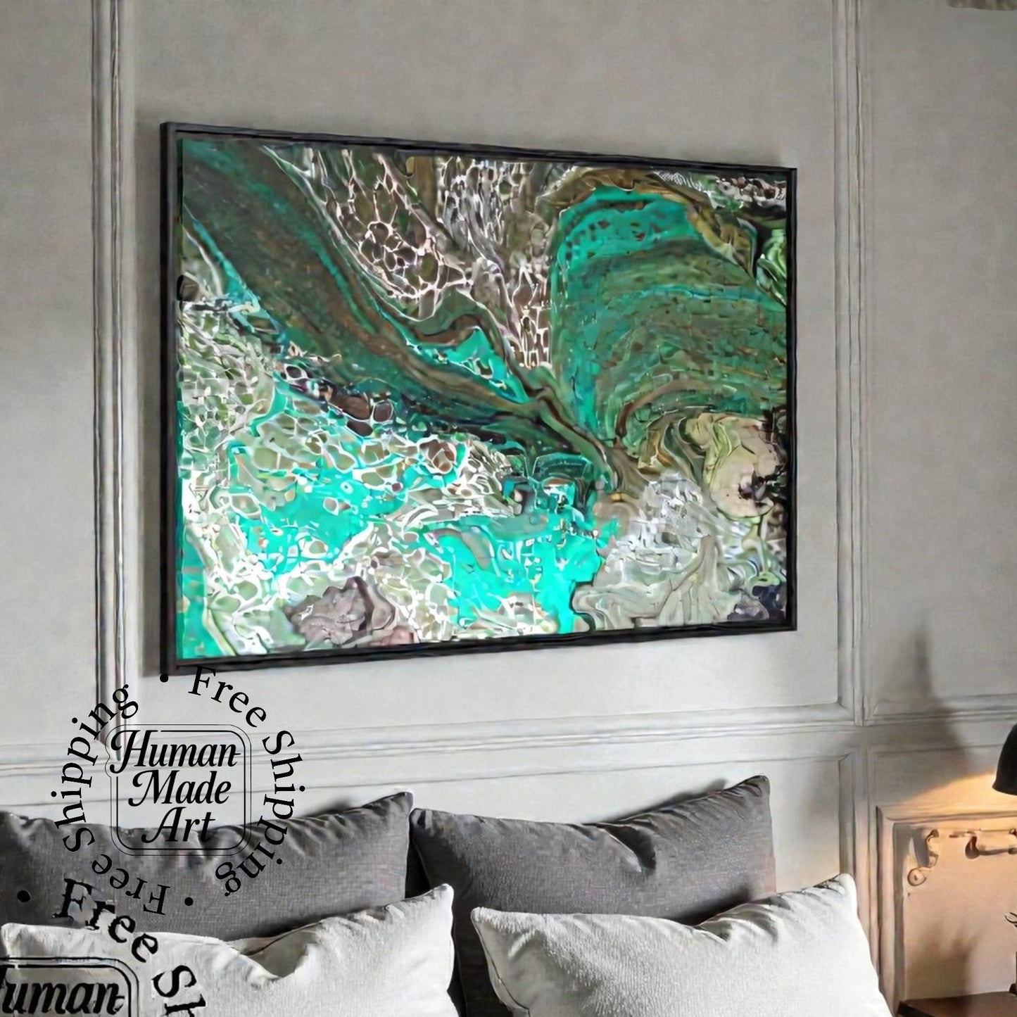 Teal abstract painting canvas print with a black frame on a wall above a sofa with decorative pillows in a living room.