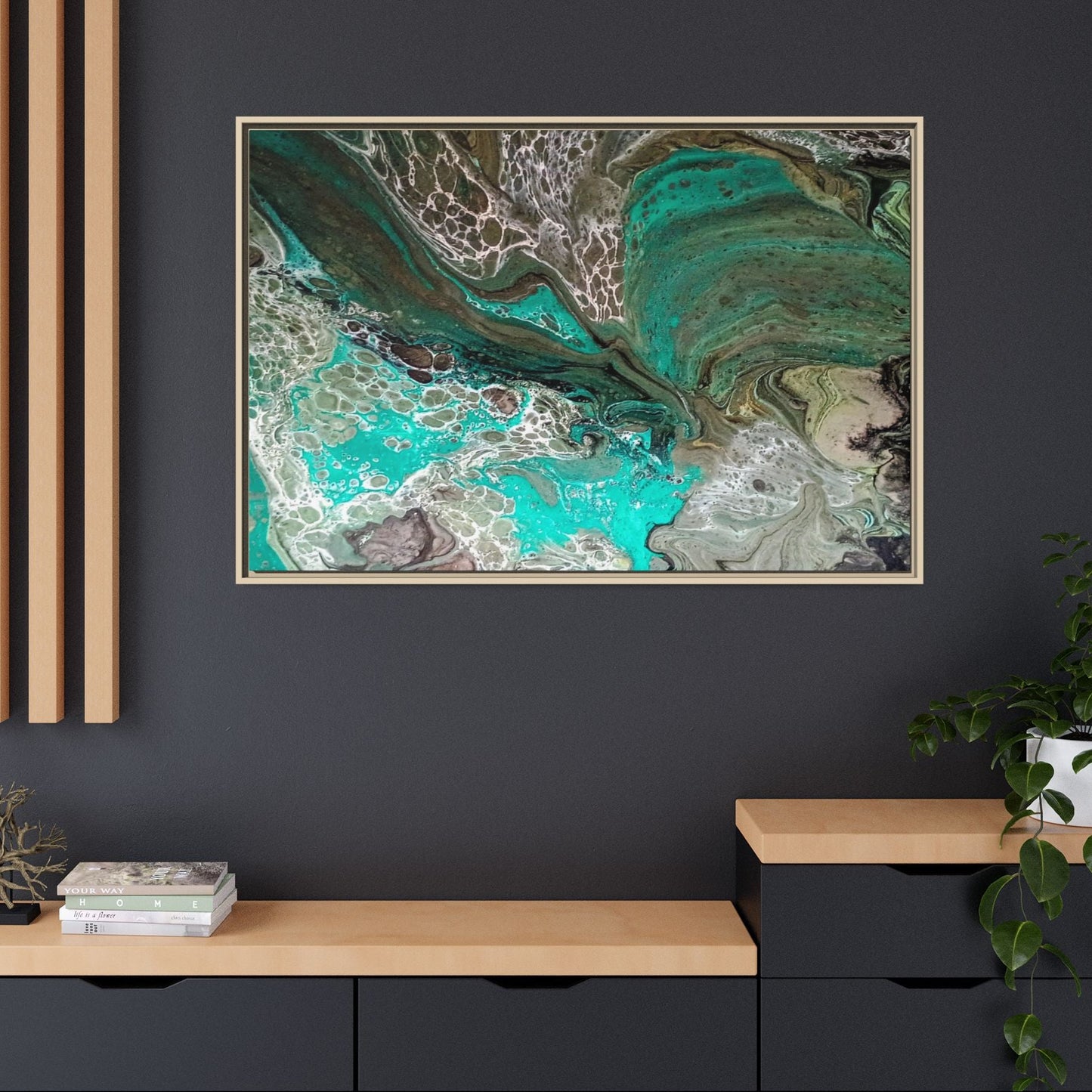 Contemporary abstract art piece with a wood frame on a dark wall with wooden shelves and boho decor accenting the painting. 