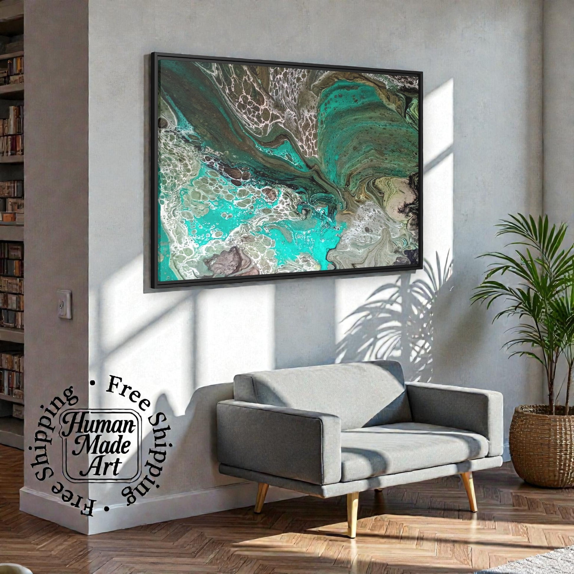 Gray sofa in a living room with a large modern abstract painting print on the wall that features teal and earth tones a Style By Jess.