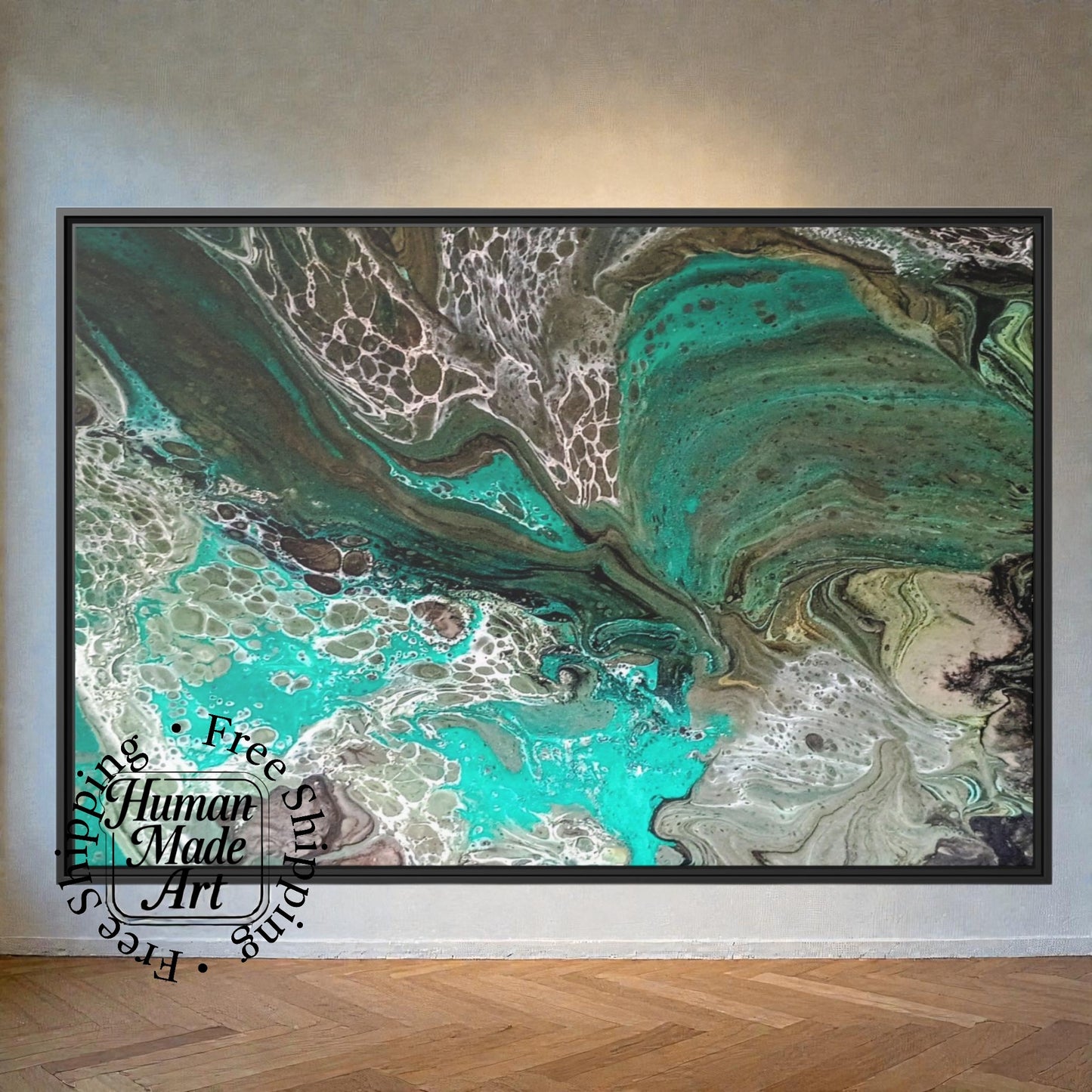 Abstract art piece with swirling green and brown colors in a black frame on a wall.