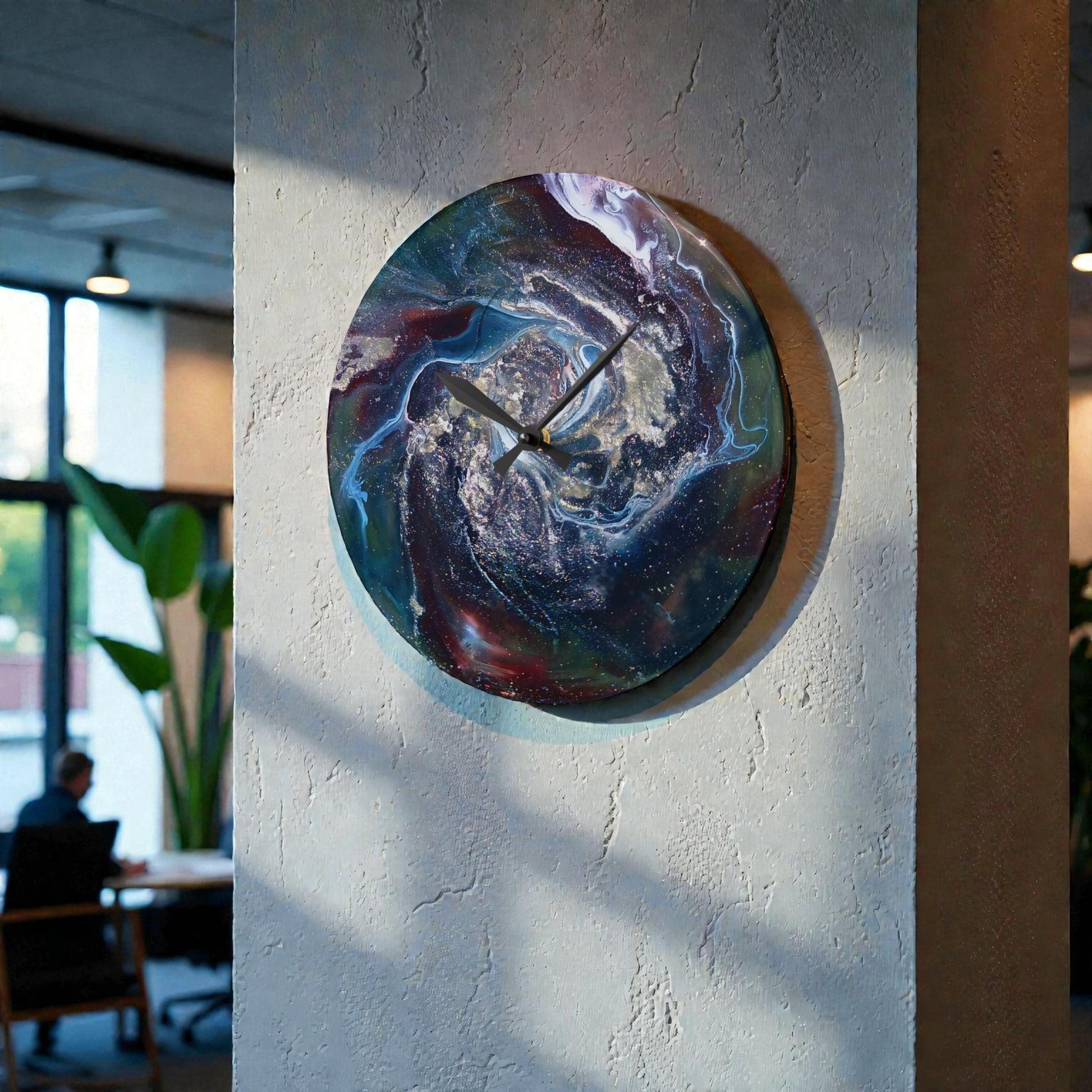 Colorful marbled wall clock on a textured wall with a blurred office background
