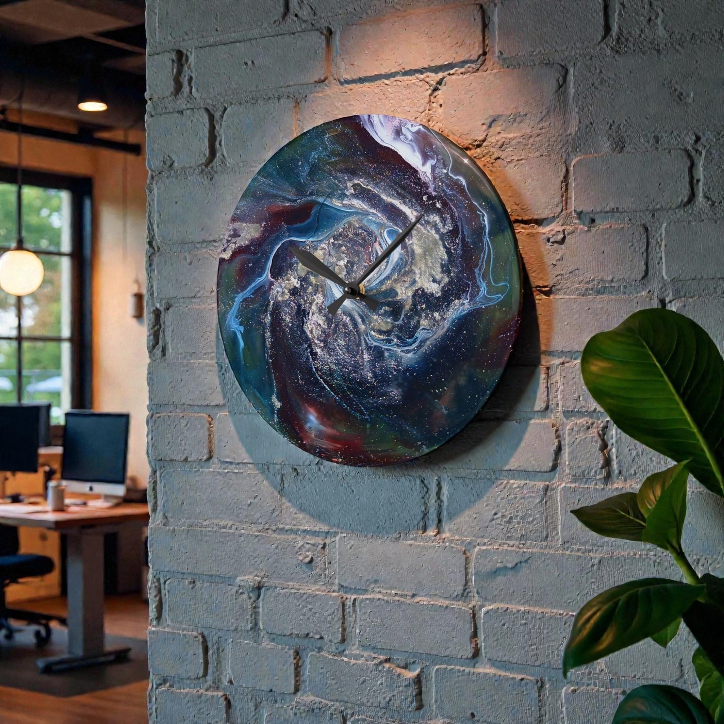 Colorful wall clock on a brick wall with office interior in the background