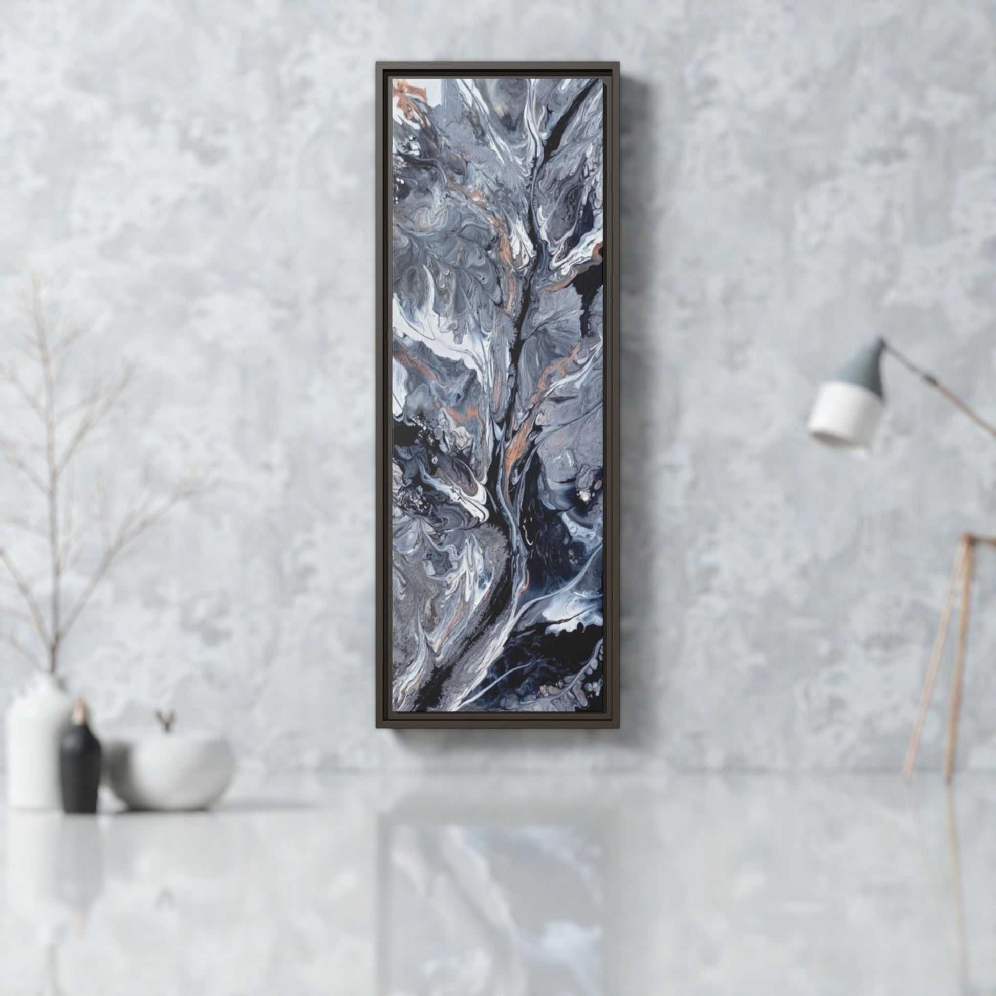 Framed abstract art piece on a gray wall in a contemporary office setting. 