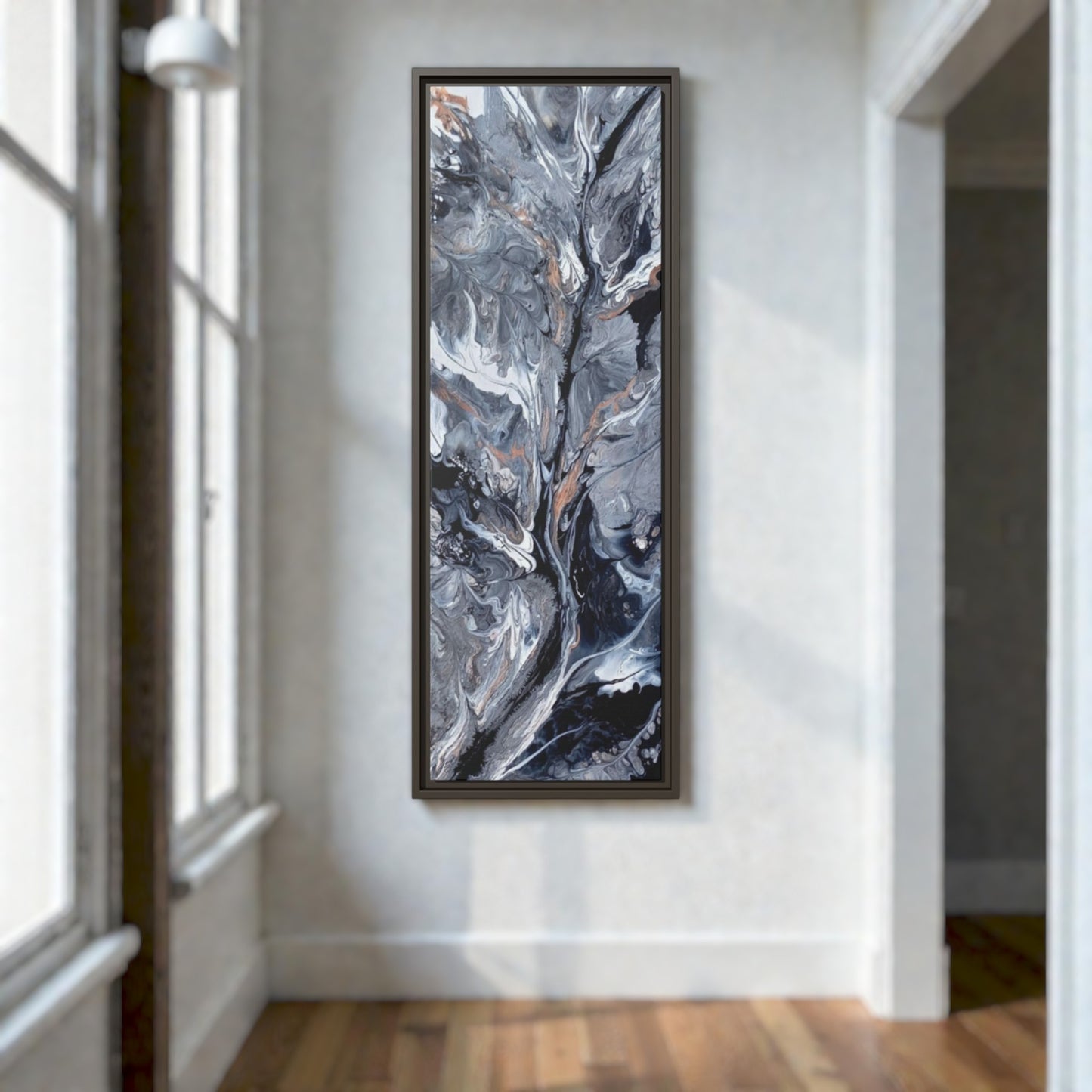 Hallway art with vertical orientation featuring abstract and contemporary design in black and white above a wood plank floor.