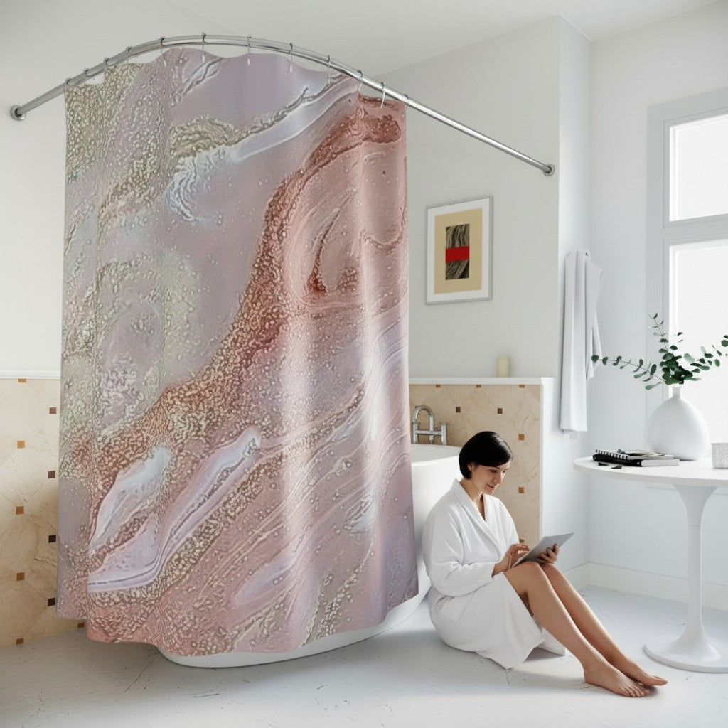 Person sitting on the floor in a bathroom with a decorative shower curtain.