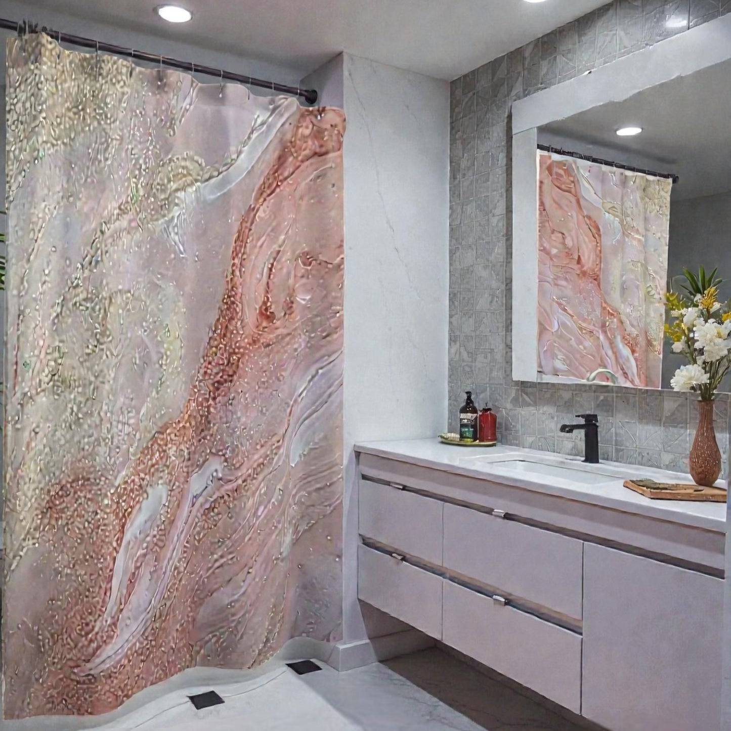 Bathroom with marble-patterned shower curtain  and vanity area with gold, white, blush and cream colors. 