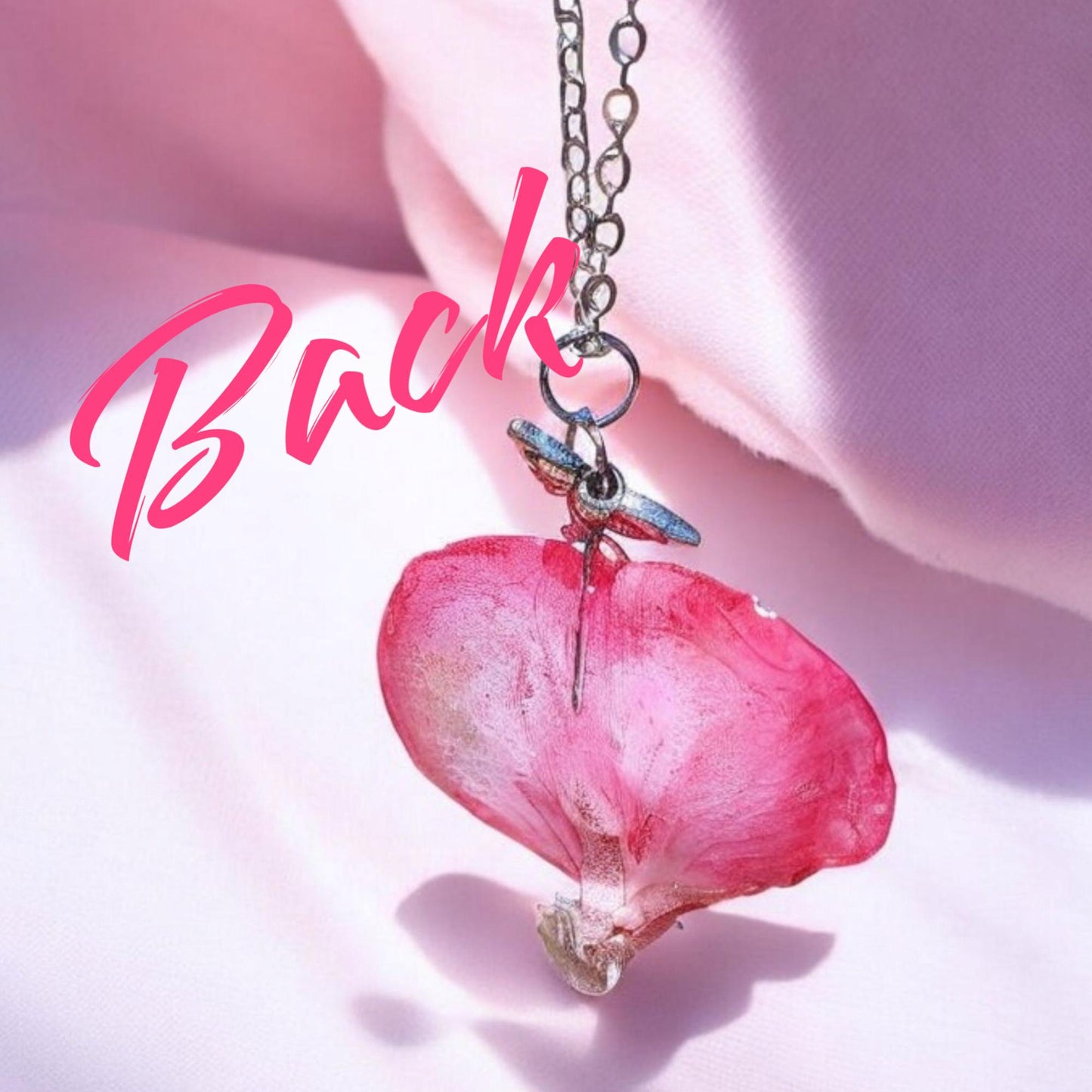 Pink flower petal pendant necklace on a soft pink background with 'Back' text.