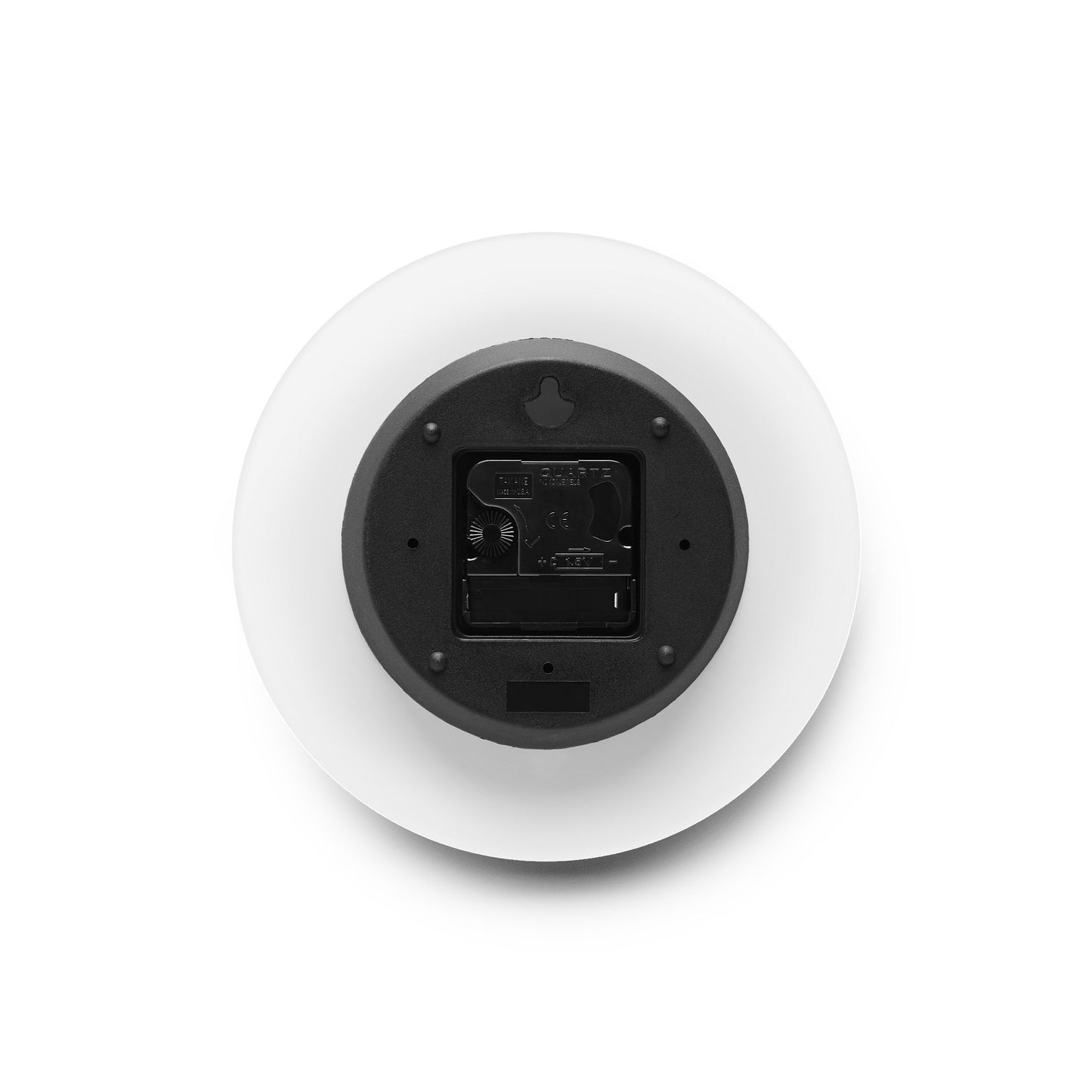 Image of the back of the acrylic wall clock showing the hanging slot and the battery compartment. 