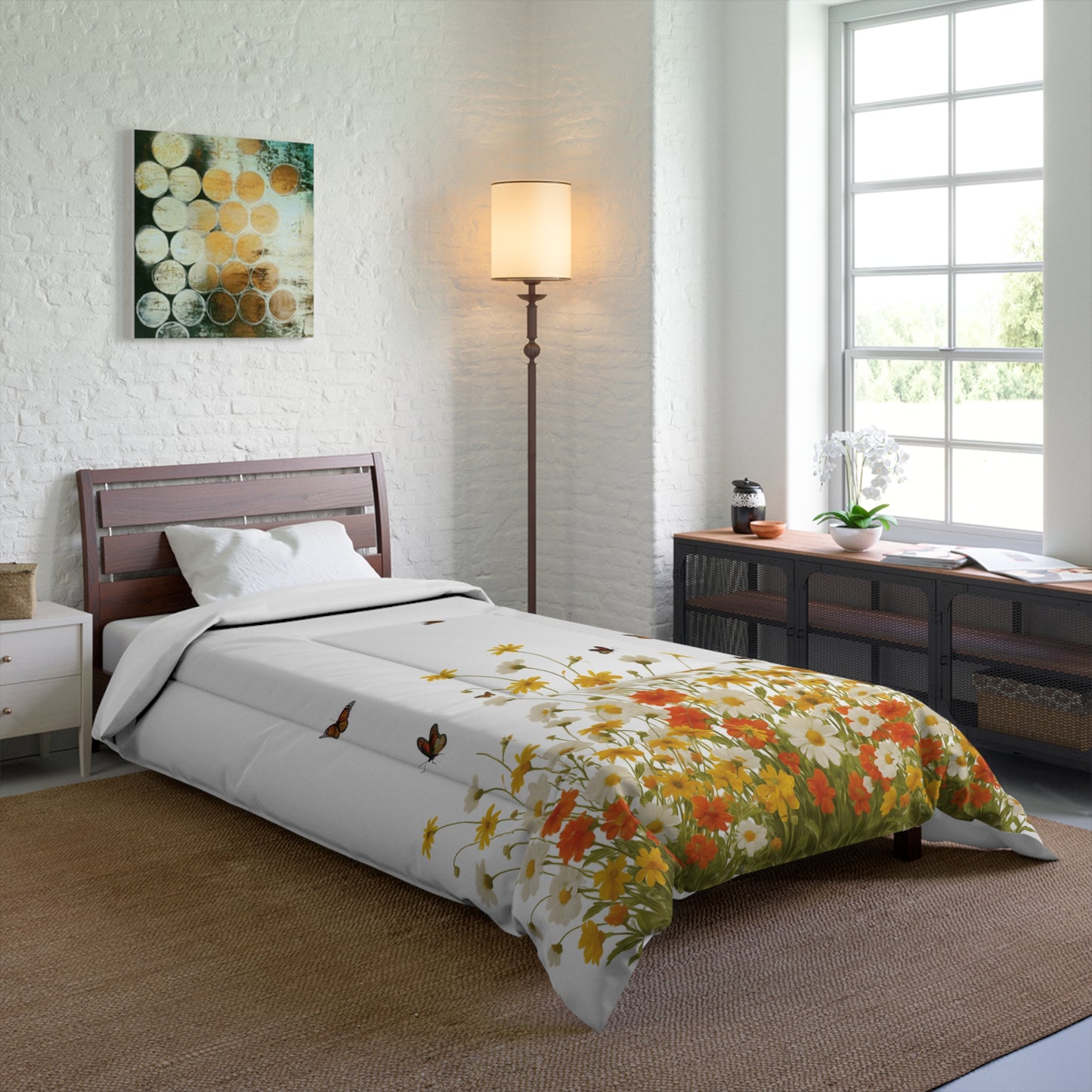 Bedroom with floral comforter on bed, lamp, and window.