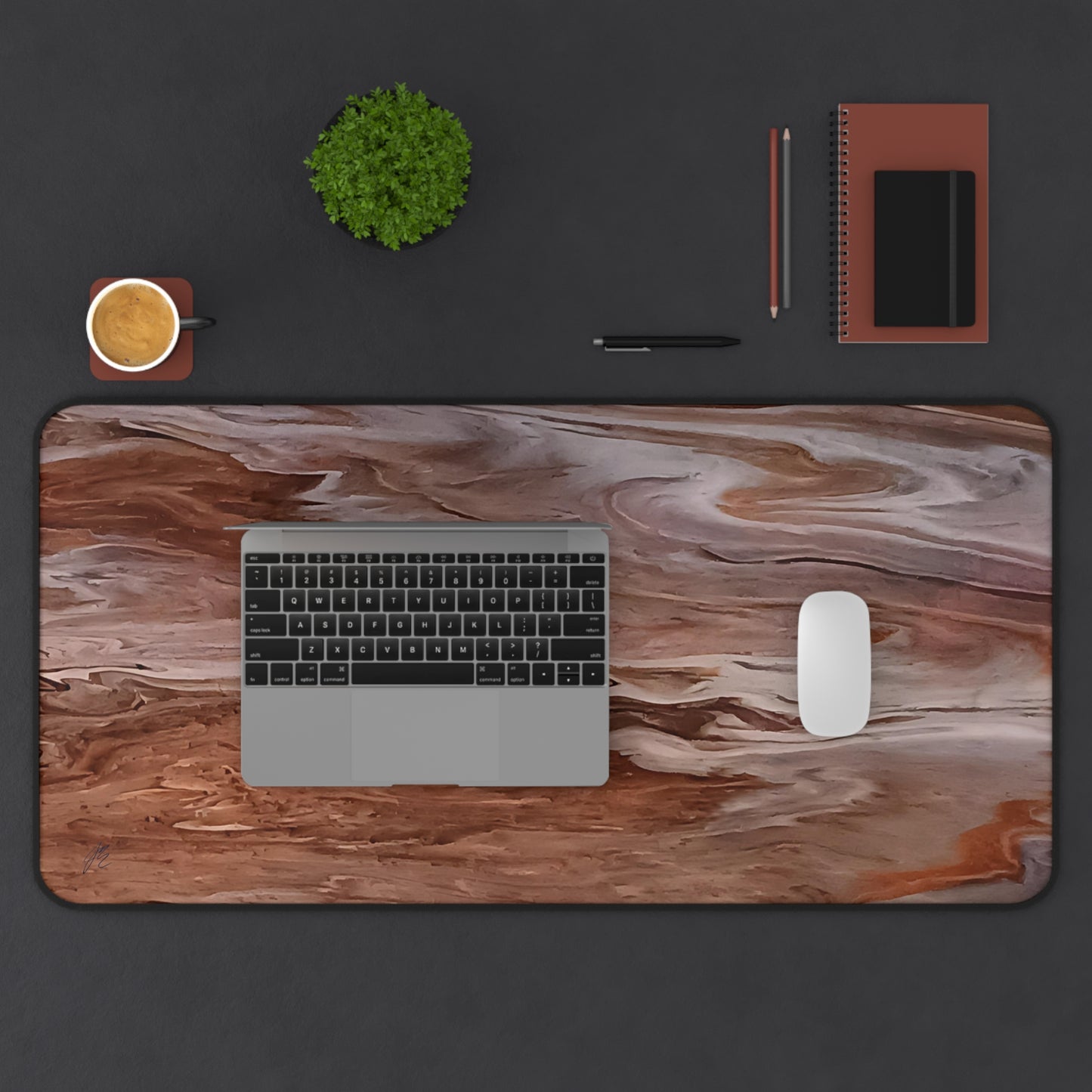 Custom printed art image of a wood like  mouse pad with laptop, mouse, and office supplies on a dark surface